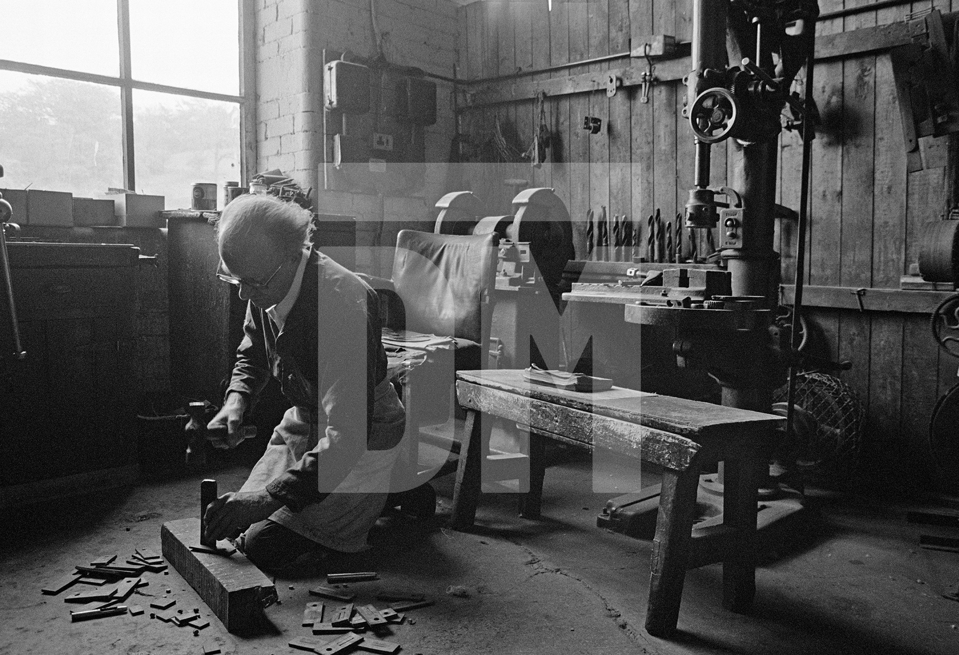 In the warehouse. Tackler (loom overlooker) in his workshop. May 1976 by Daniel Meadows