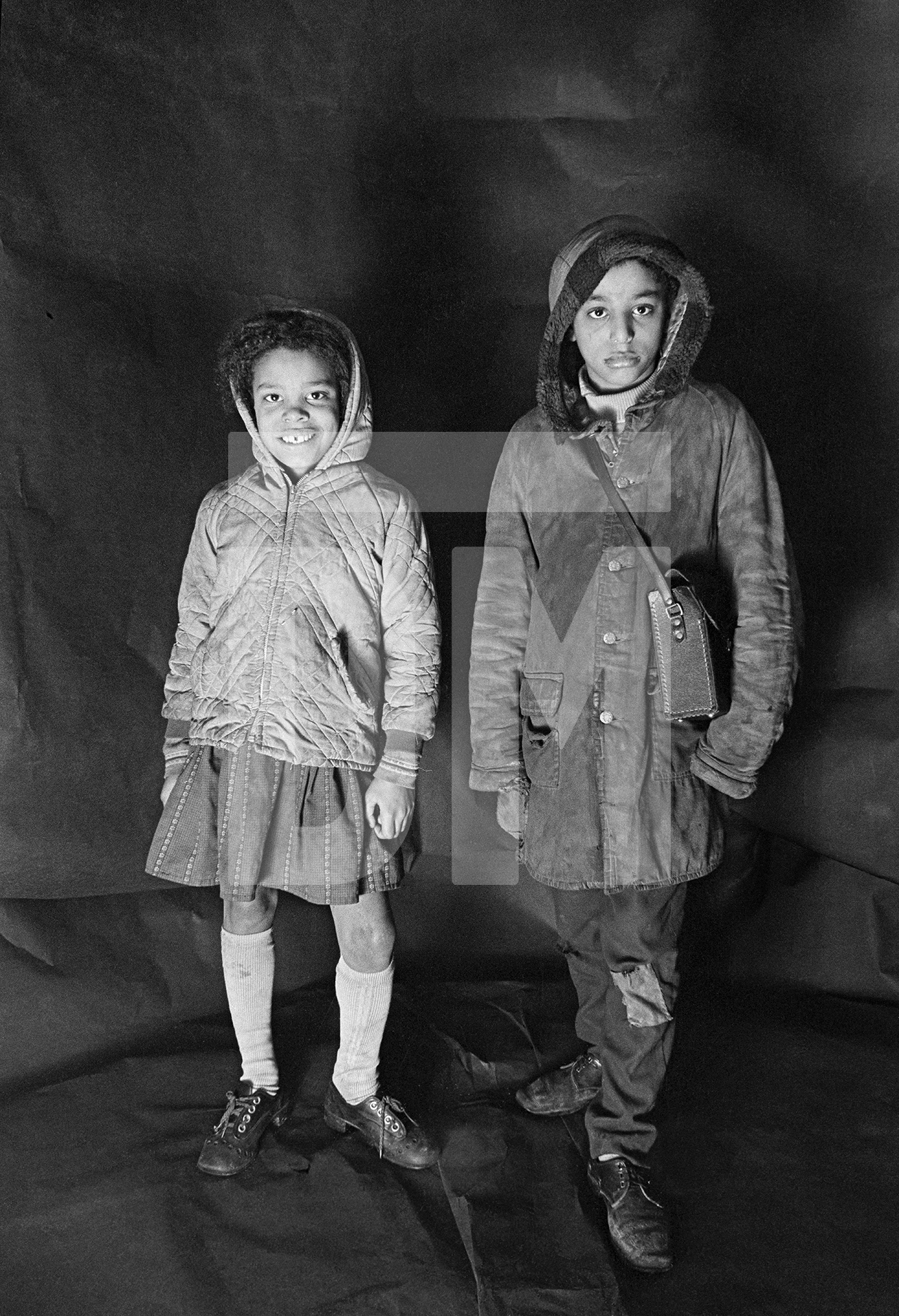 Angela Loretta Lindsey, aged 8, with her brother Mark Emanuel Lindsey. Portrait from The Shop on Greame Street, Moss Side, Manchester. February-April 1972 by Daniel Meadows