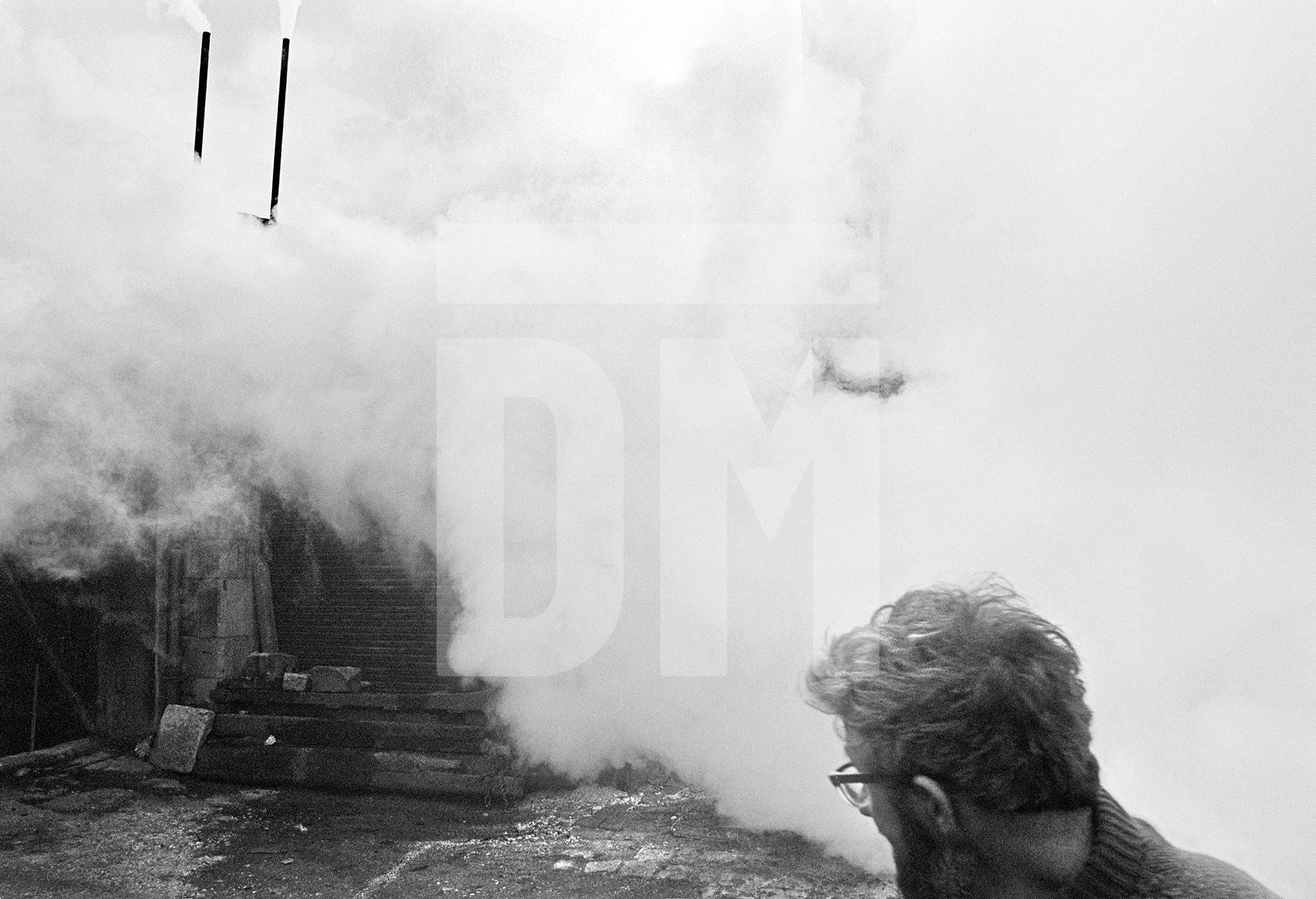 Stanley Graham, mill engineer, blowing down the boiler. April 1977 by Daniel Meadows