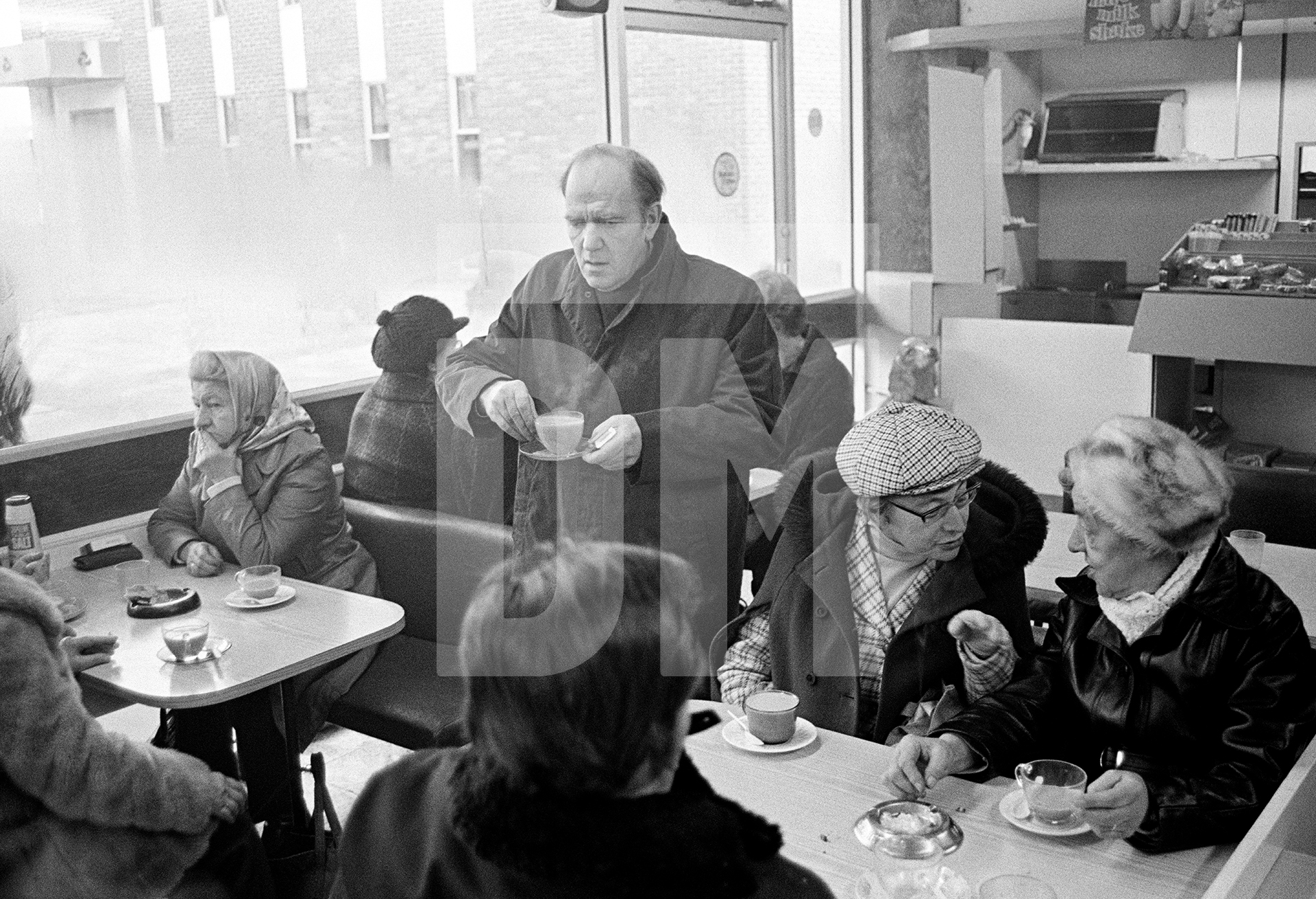 John Joe Canney, aged 54, has a supervised visit to a café. February 1978 by Daniel Meadows