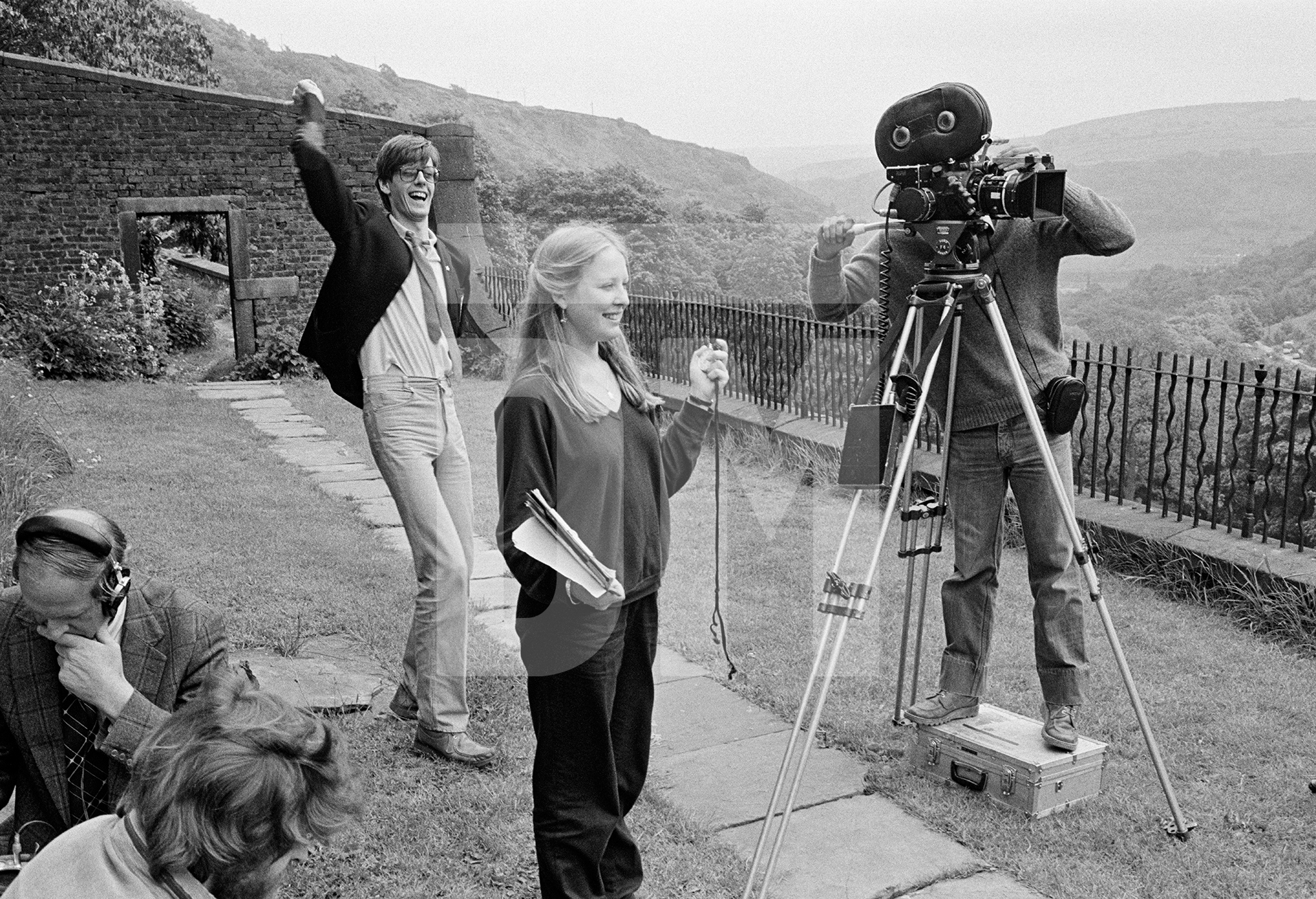 Filming on location, David Liddiment directs, Toni (Antonia) Ackland, PA with stopwatch, The Arvon Foundation, Lumb Bank, Heltonstall. June 1979 by Daniel Meadows