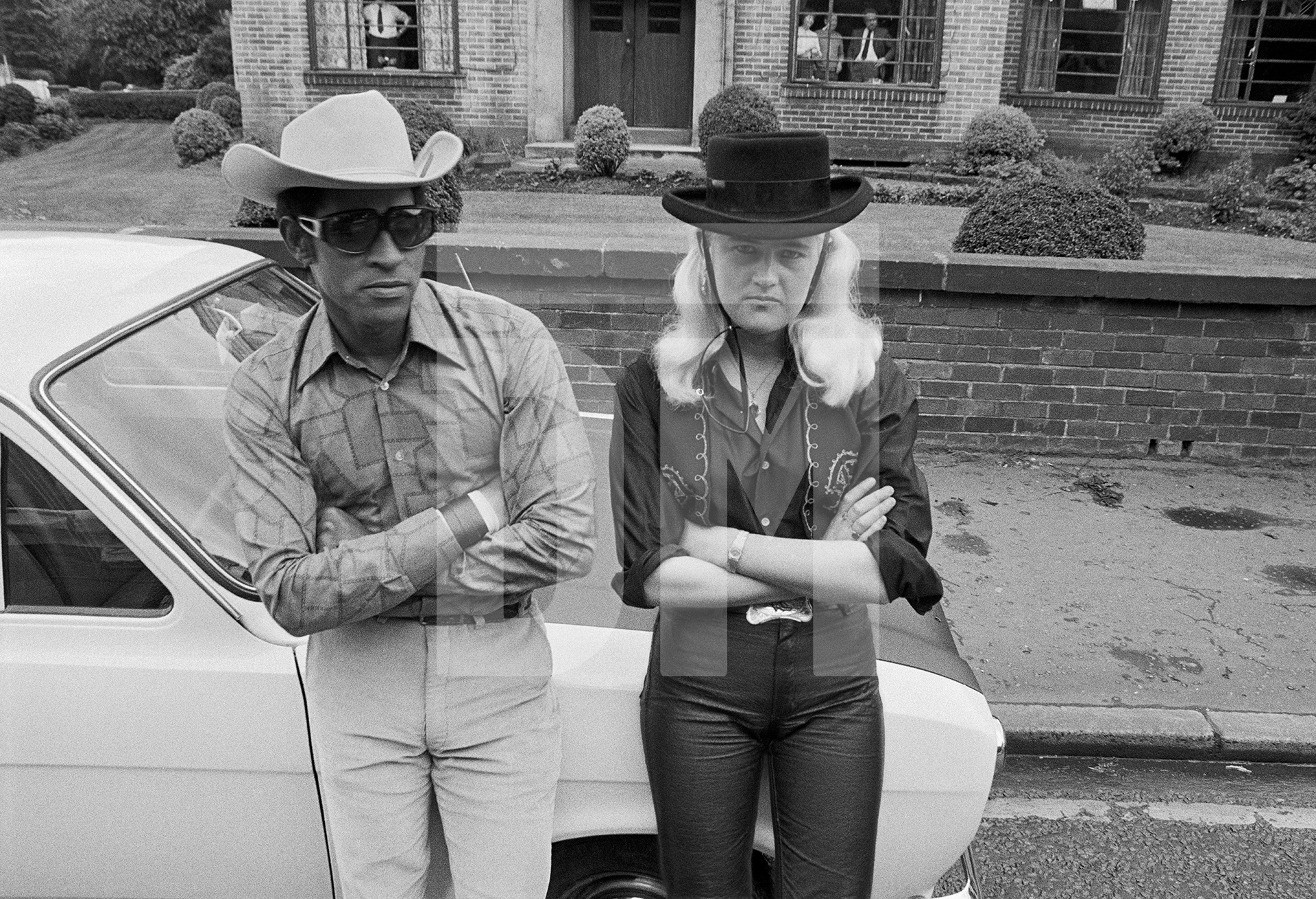 Spectators at the Caribbean Carnival, Alexandra Road, Moss Side, Manchester. Whitsun Bank Holiday, 1972 by Daniel Meadows