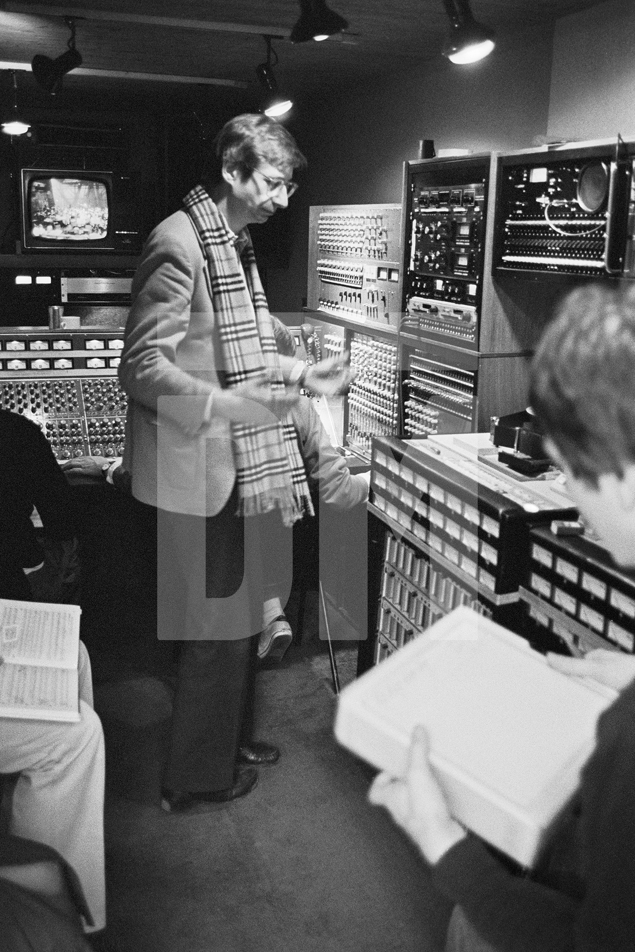 Director Tony Palmer in the engineer’s truck during audio recording with the English Chamber Orchestra. Elstree Studios, 29 December 1980 by Daniel Meadows