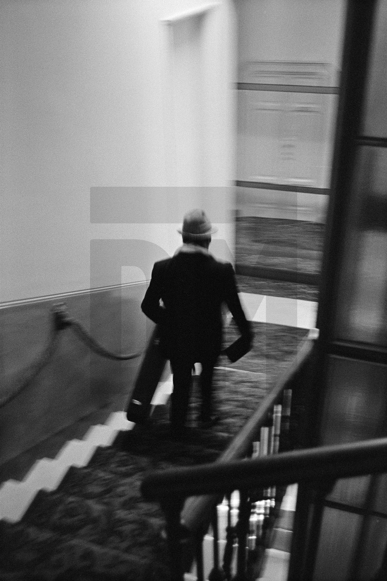 Julian Bream leaving hotel for a performance, Milan. 15 March 1981 by Daniel Meadows