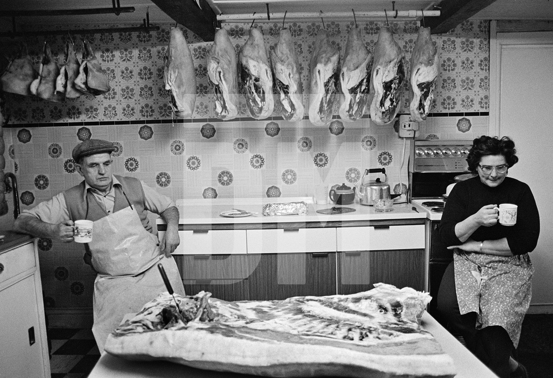 Bacon rolling. Cyril and Elsie Richardson enjoy a coffee break. North Yorkshire 1976 by Daniel Meadows