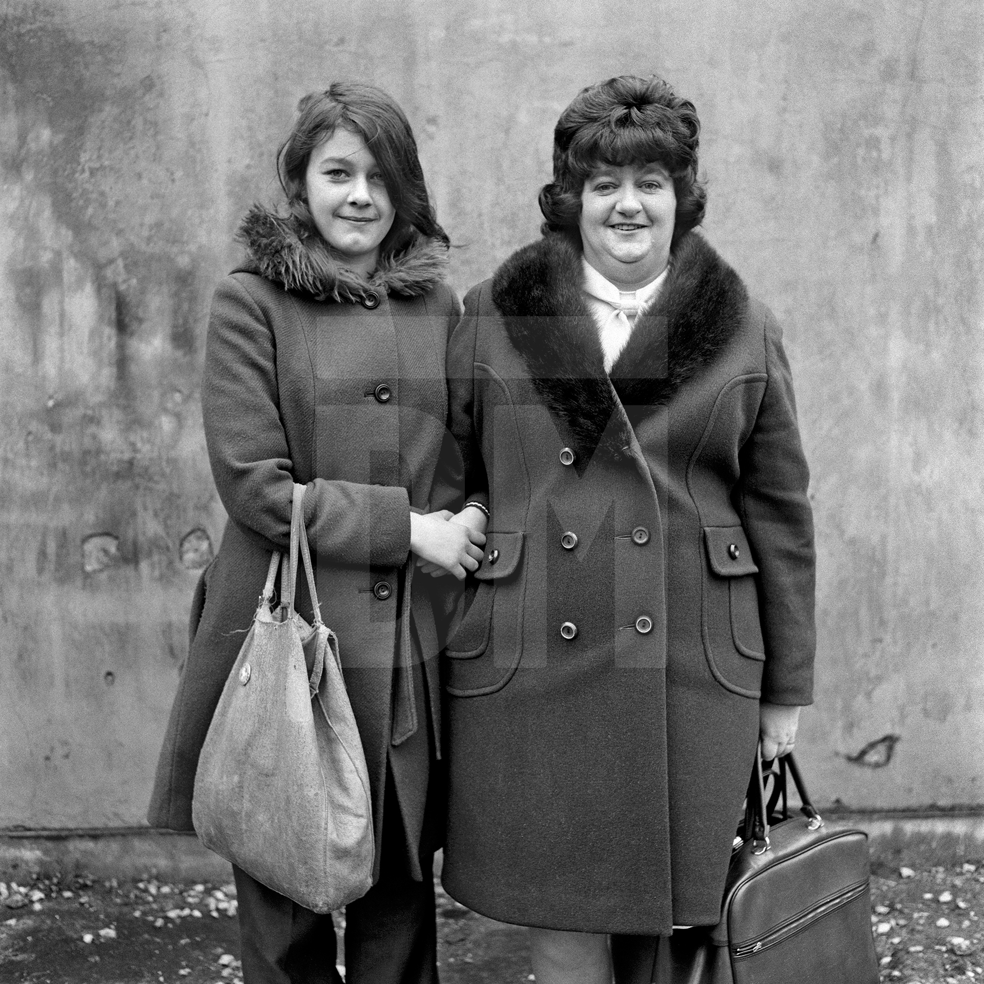 Daughter and mother, left Karen Cubin, right Barbara Taylor, Barrow-in-Furness, Cumbria. November 1974 by Daniel Meadows