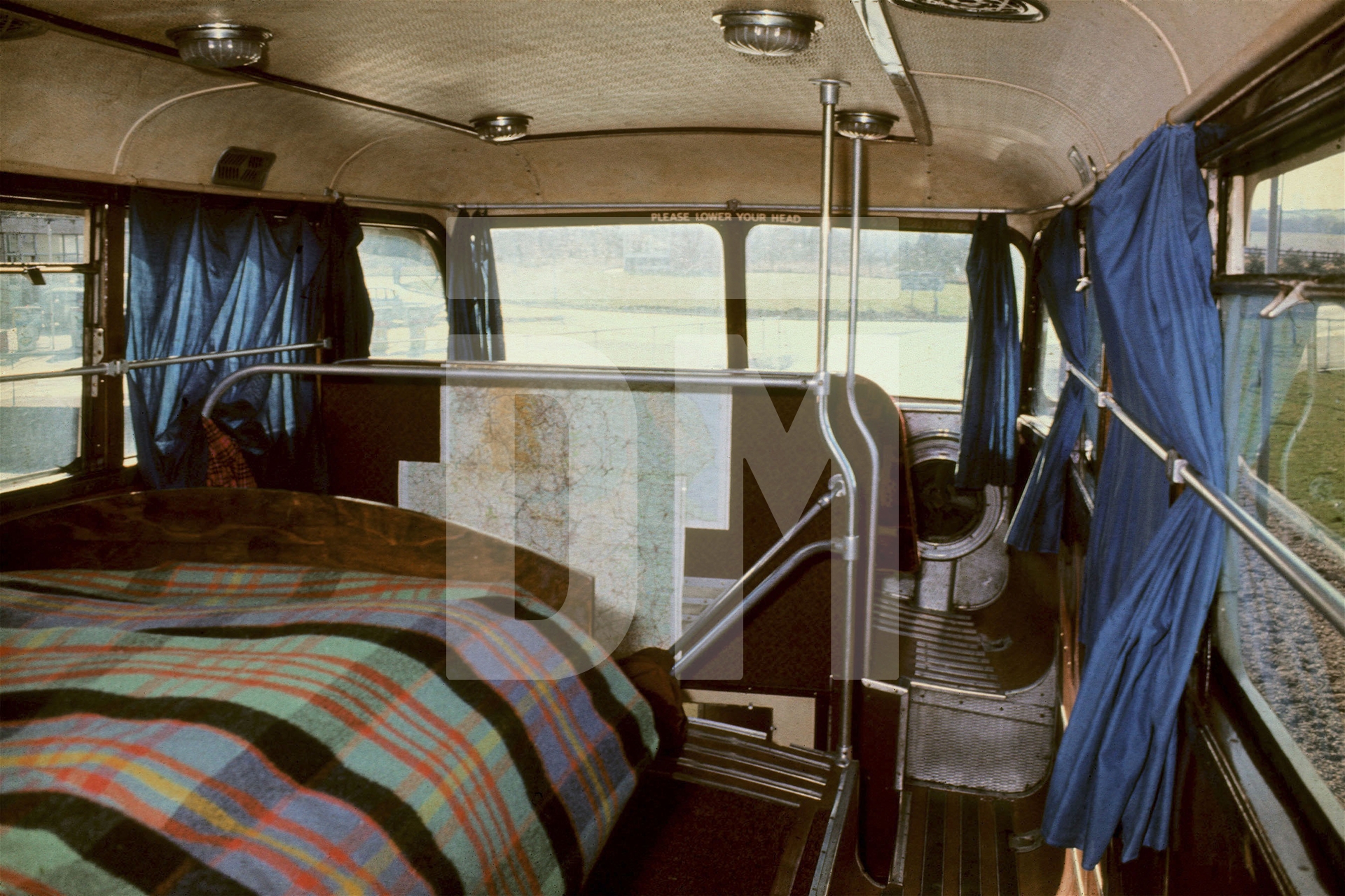 Free Photographic Omnibus, interior upstairs looking towards the front. Birmingham, March 1974 by Daniel Meadows