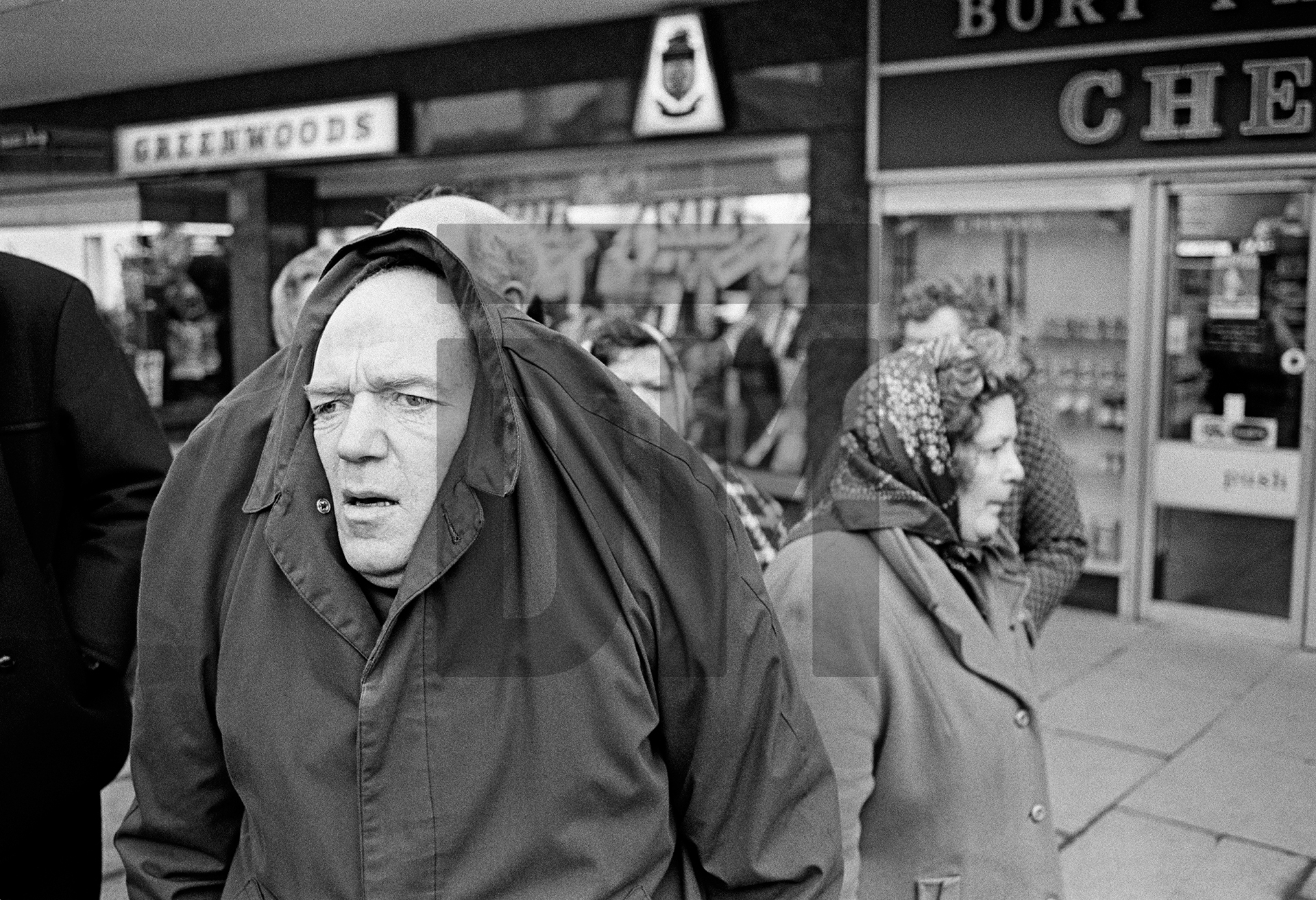 John Joe Canney, aged 54 formerly a bobbin carrier, finds a supervised trip out to Bury market all a bit much. February 1978 by Daniel Meadows