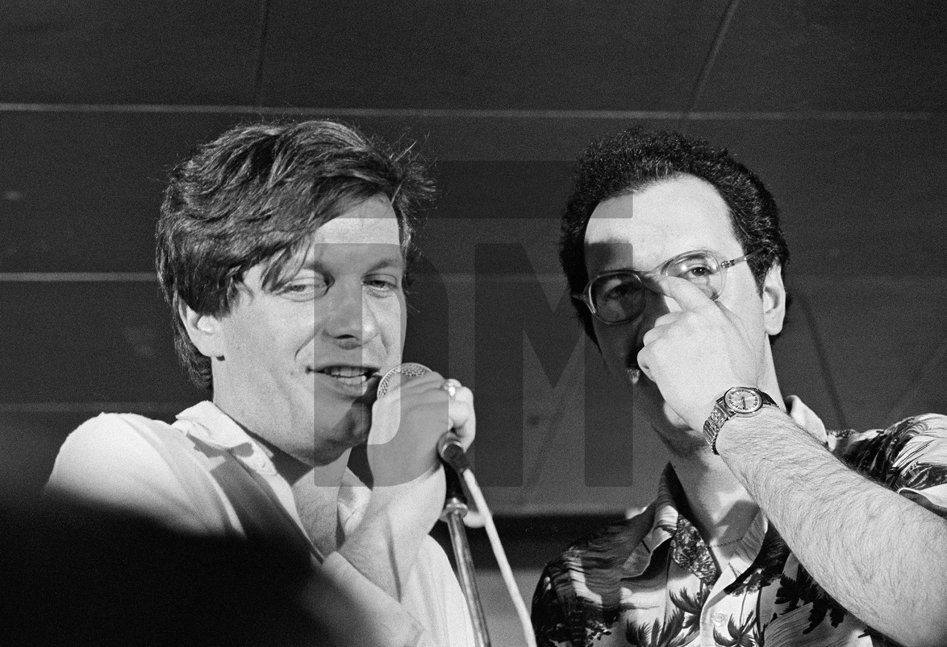 Tony Wilson and club promoter Alan Wise, at the Russell Club, Hulme, for a ‘Factory’ night. ‘What’s On’ programme from Granada TV on location. April 1979 by Daniel Meadows