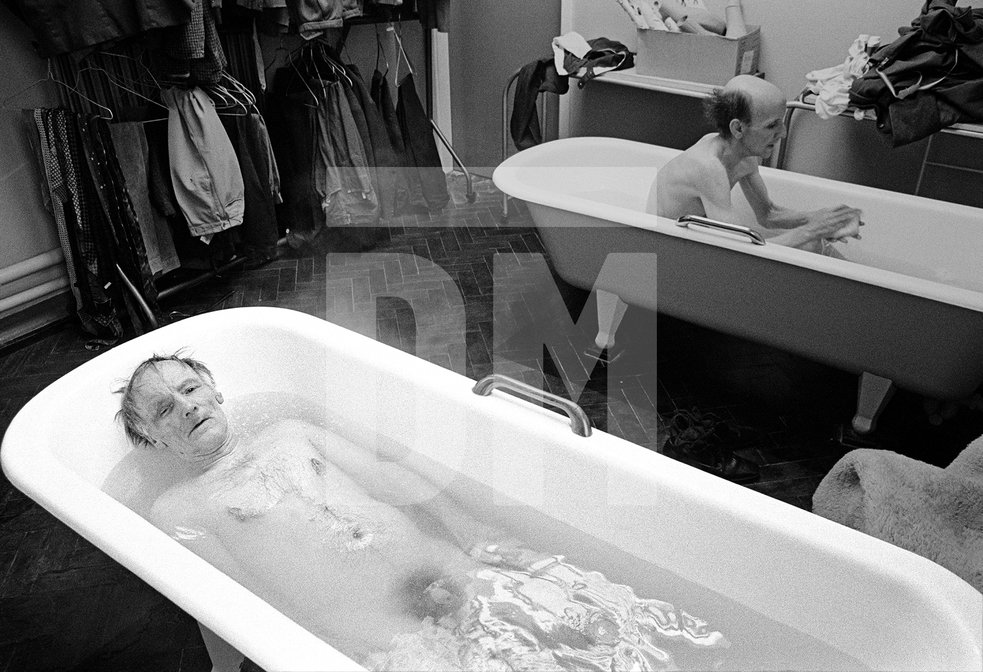 Frank Tattersall aged 56, a former turner who was admitted in 1957, takes a bath. February 1978 by Daniel Meadows