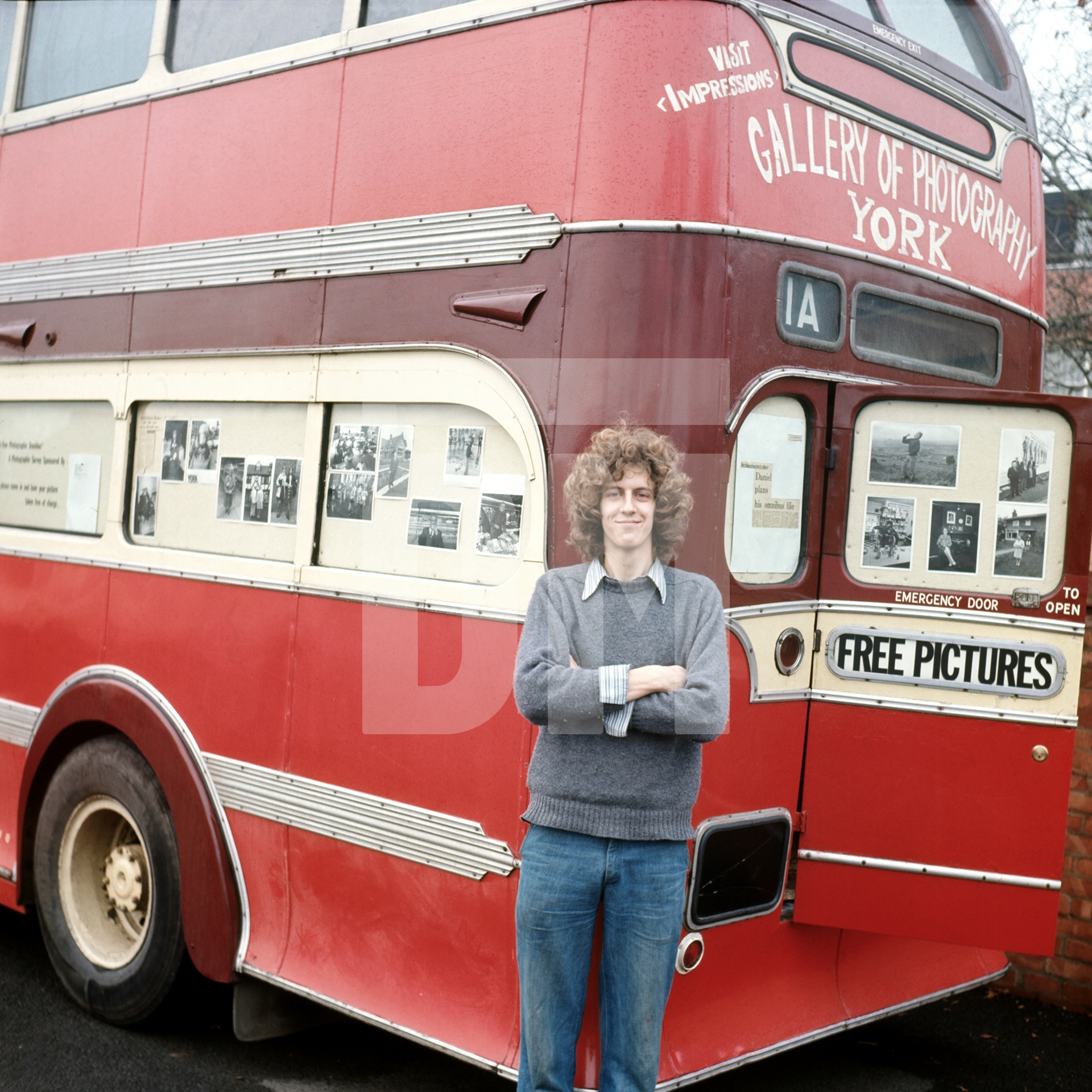 In late 1973, Andrew Sproxton of Impressions Gallery in York visited Daniel and, using a pair of scissors, cut freehand from a roll of stickyback plastic, a tailor-made advertisement which he applied to the rear upper exterior of the Free Photographic Omnibus. by Daniel Meadows