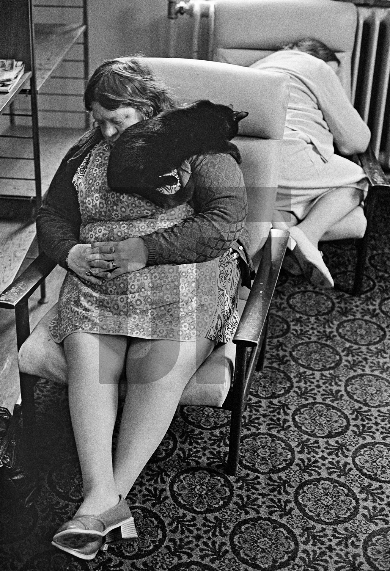 Former housewives Evelyn Clarke (with the ward cat) and Elizabeth Irving, both aged 54. February 1978 by Daniel Meadows