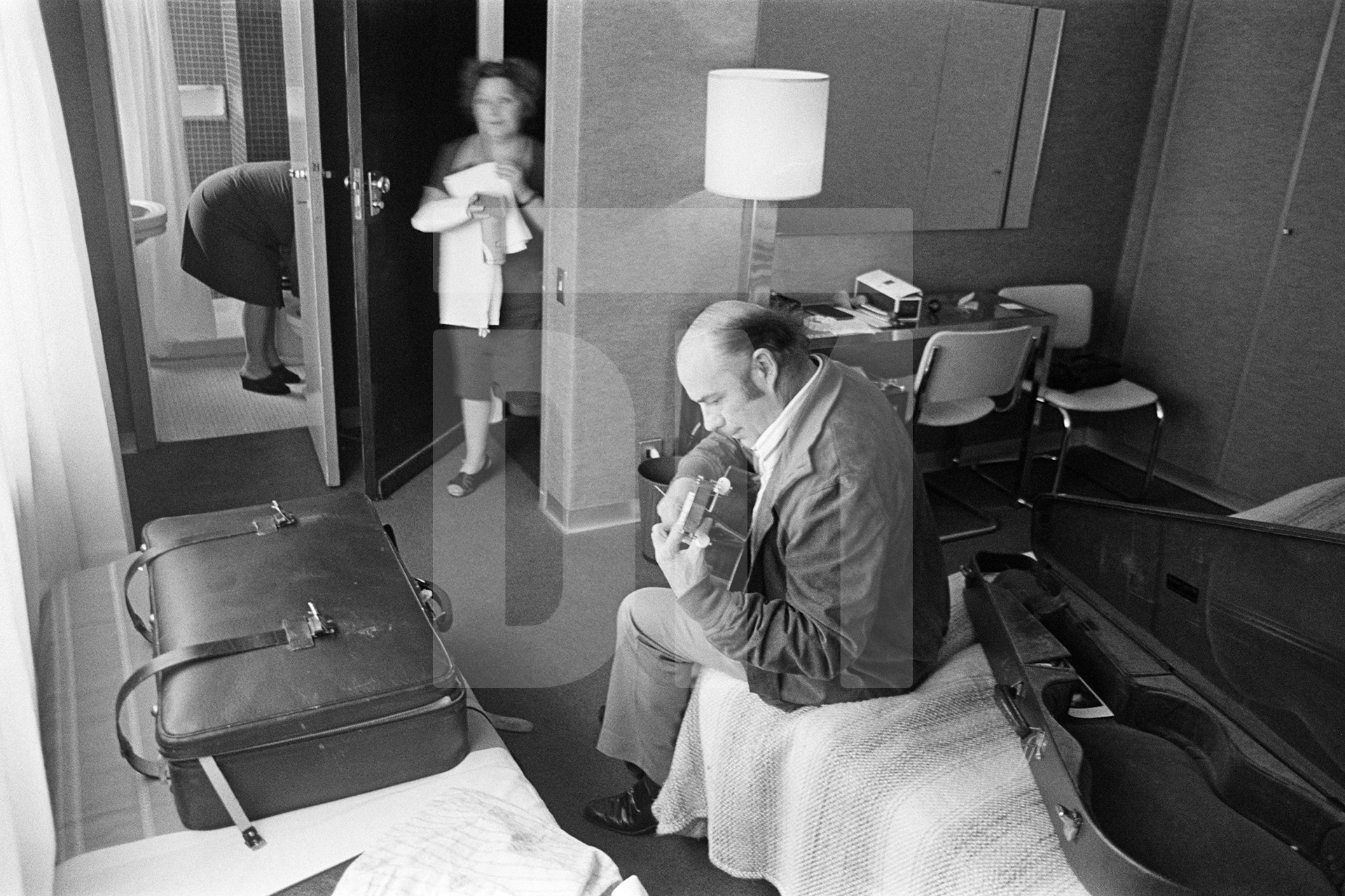 Julian Bream practising guitar in Hotel Claridge, Rome. 17 March 1981 by Daniel Meadows