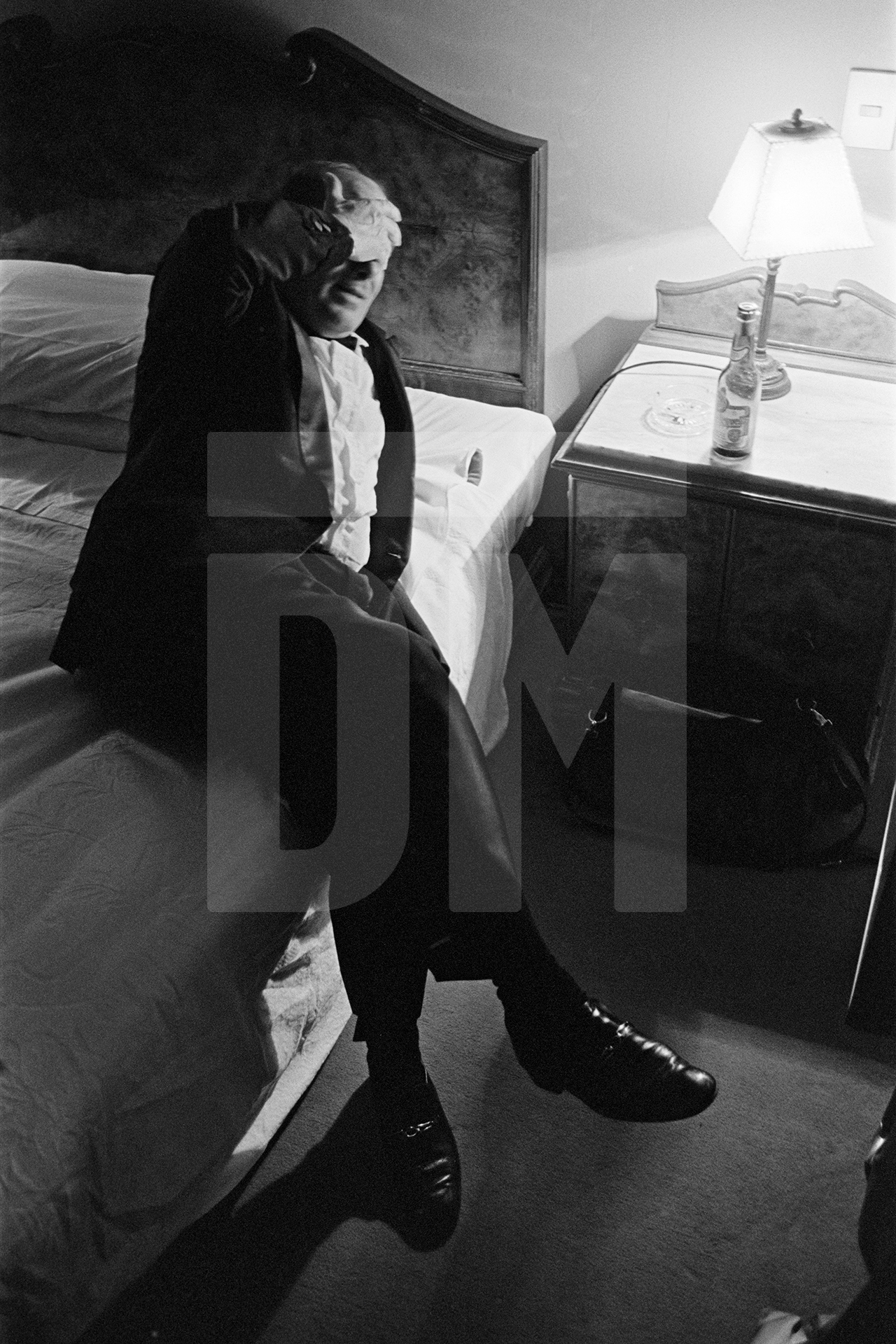 Julian Bream, late evening after performance, hotel, Italy. March 1981 by Daniel Meadows