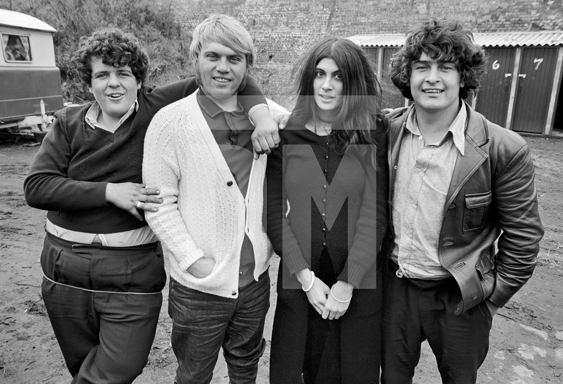 Shireen Shah third from left, sociology student at Manchester Polytechnic, whose undergraduate dissertation was illustrated with photographs from this series. Gypsy and Traveller Site, Stockport. 1971 by Daniel Meadows