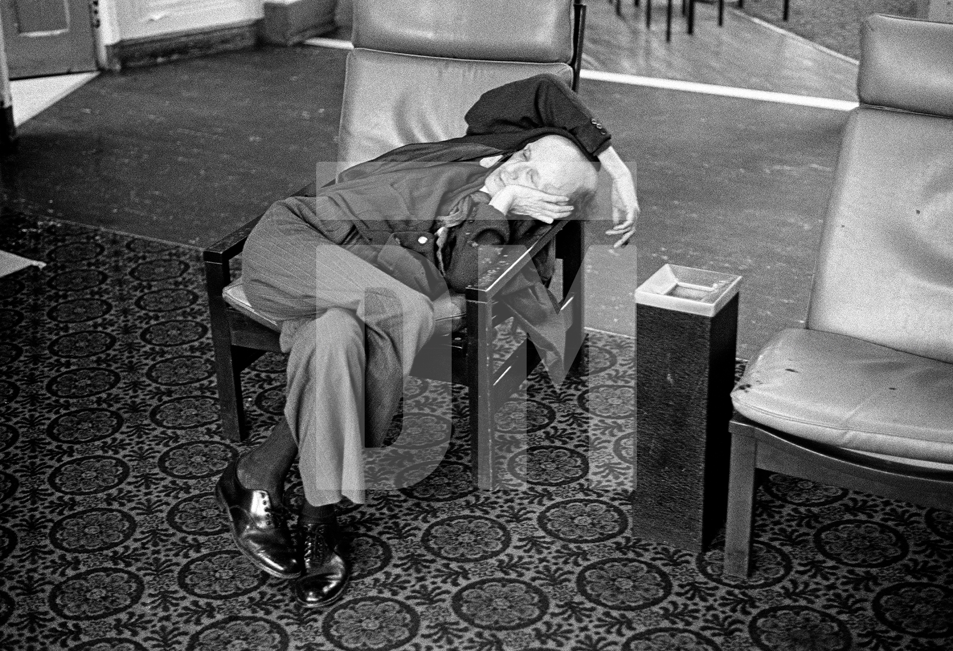 Derek Croley, aged 52, who was admitted to the hospital in 1952 resting in the day-room. February 1978 by Daniel Meadows