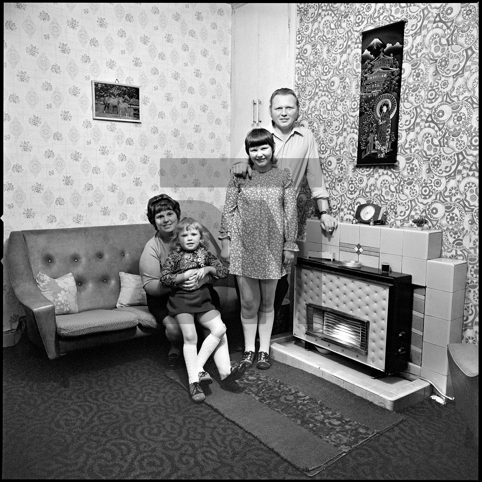 Mary and John Rowlands and daughters Sandra (standing) and Gillian. (Identified as her relations in 2011 by Debbie Fielding, publications administrator at Cornerhouse.) Residents of June Street, Salford. 1973 by Daniel Meadows