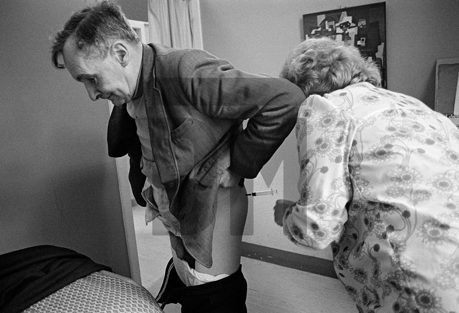 Medication makes the Clayton Ward project possible. Here a patient receives his Modecate (tranquilizer) injection. Largactil (taken orally) is also prescribed. February 1978 by Daniel Meadows