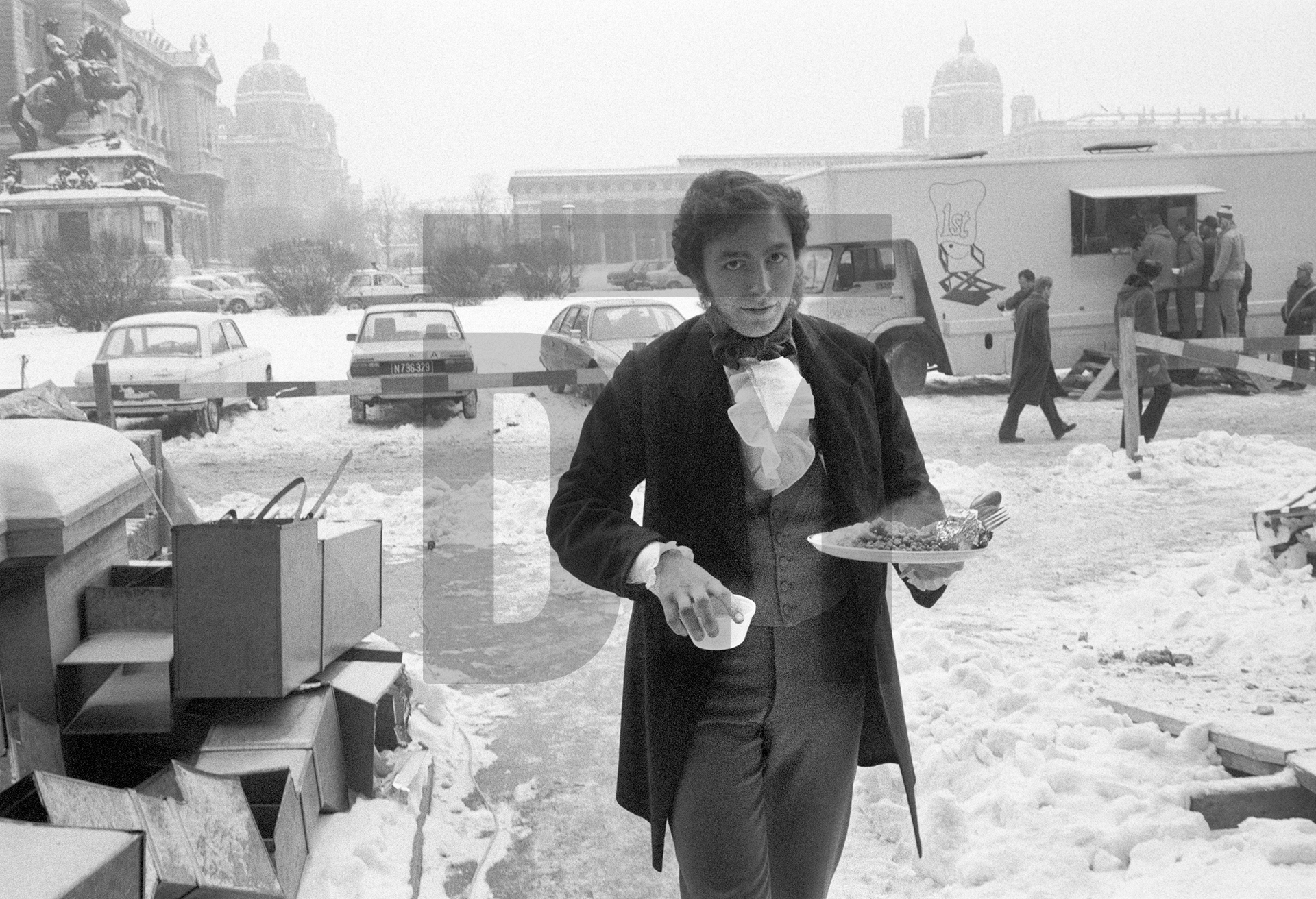 Meal time for cast and crew on the set of 'Wagner'. Vienna 1982 by Daniel Meadows