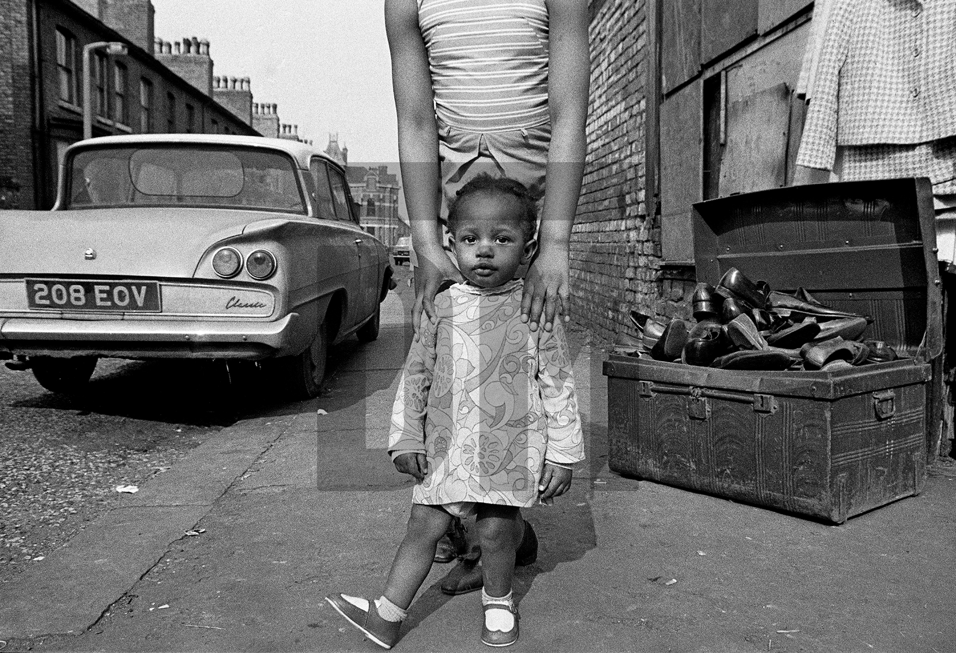 Portrait made on the street outside The Shop on Greame Street, Moss Side, Manchester. February-April 1972 by Daniel Meadows