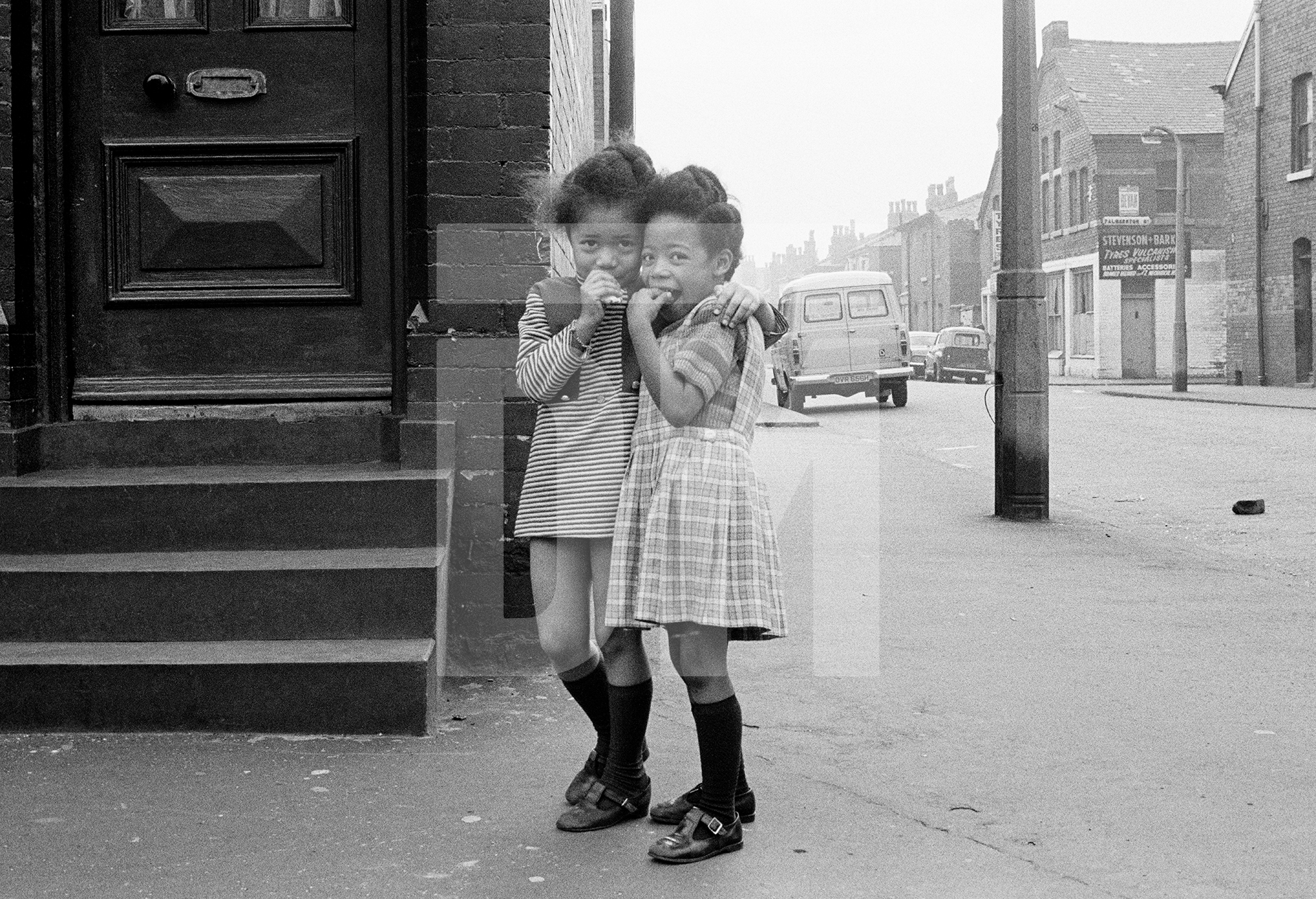 Left-to-right: Veronica Thompson, Sharon Richards, Moss Side, Manchester. 1972 by Daniel Meadows