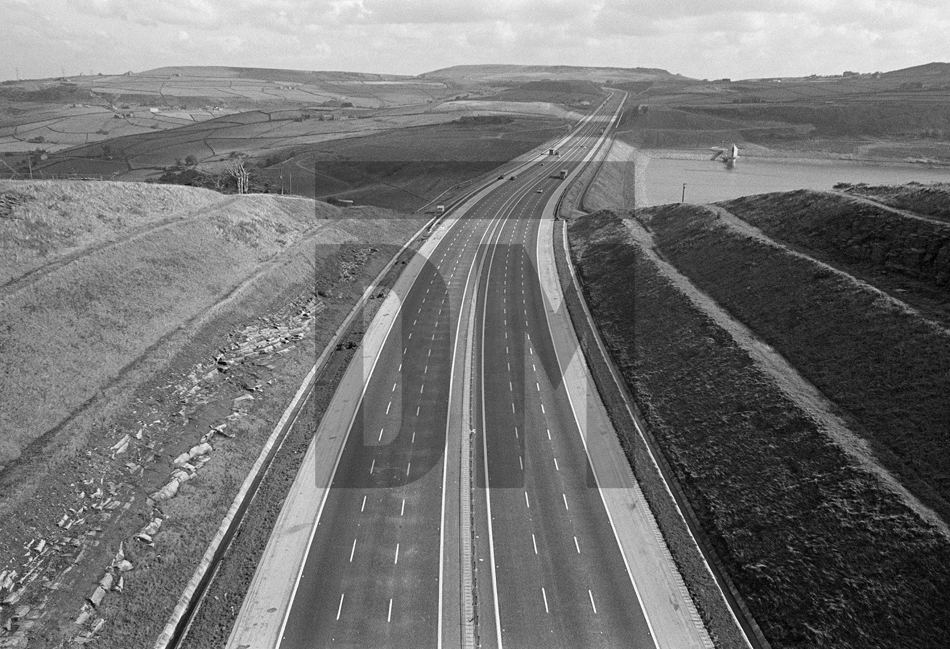 M62 motorway near Ripponden, Scammonden Reservoir to the right, West Yorkshire. October 1973 by Daniel Meadows