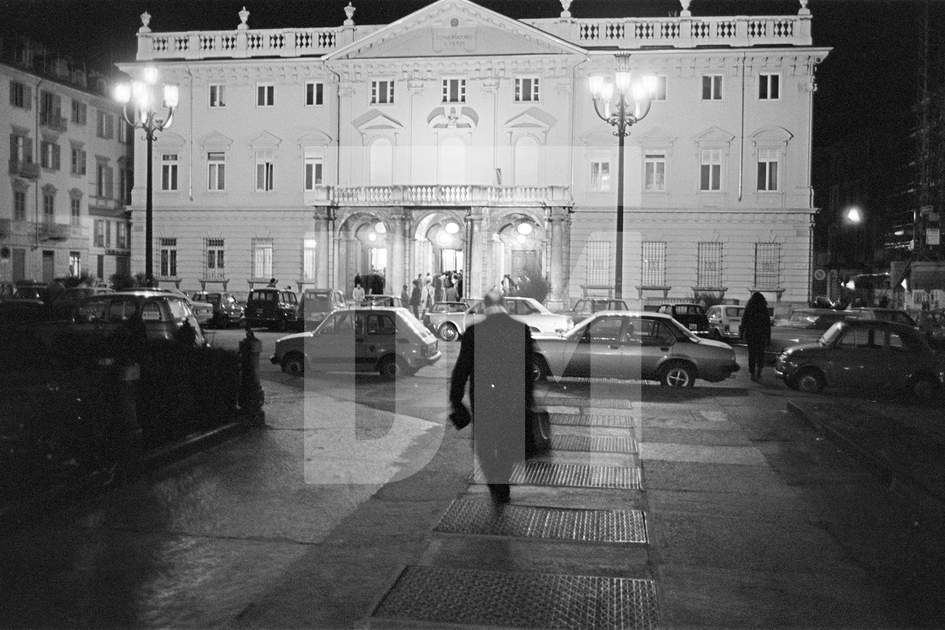 Julian Bream arriving for his performance at the Turin Conservatory. 18 March 1981 by Daniel Meadows
