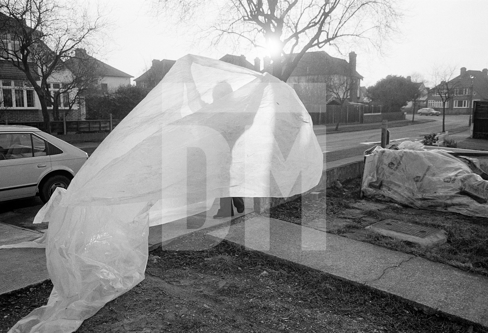 Evening DIY, Hayes, Kent. February 1985 by Daniel Meadows