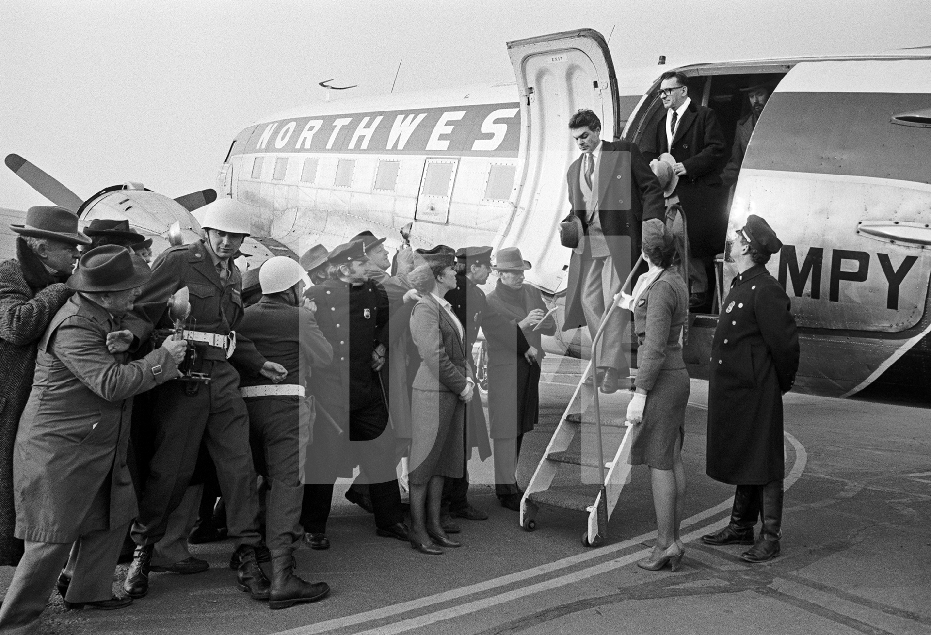 Arrival in New York. Ben Kingsley [Dmitri Shostakovich] at top of steps.  Location: Coventry airfield.  March 1987 by Daniel Meadows