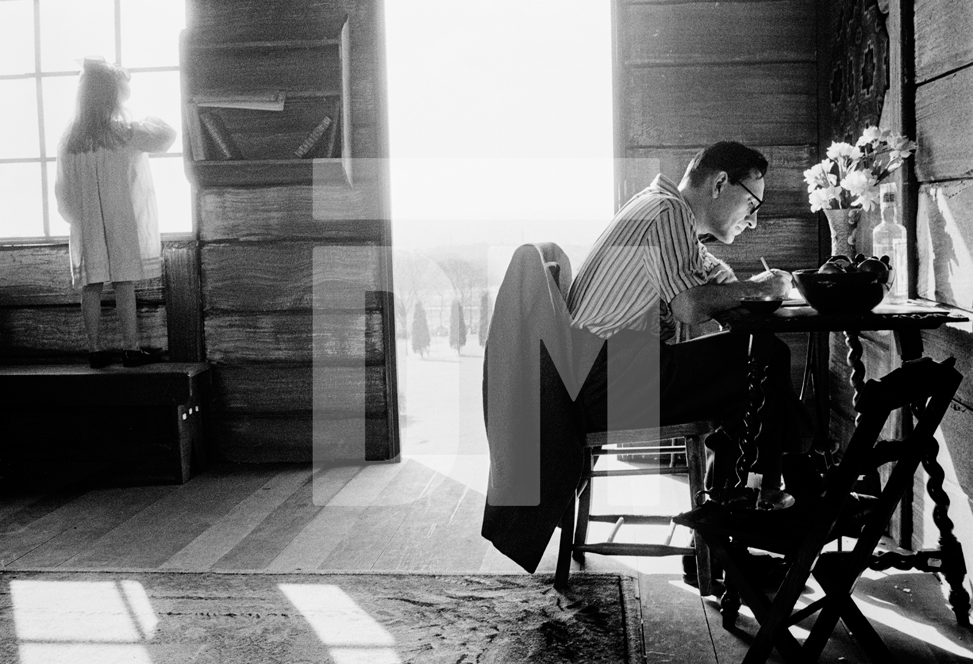 Ivanovo. Ben Kingsley [Dmitri Shostakovich] at desk. Magdalen Asquith [Galya Shostakovich, his daughter] at window.  Location: Haigh Hall, Wigan.  February 1987 by Daniel Meadows