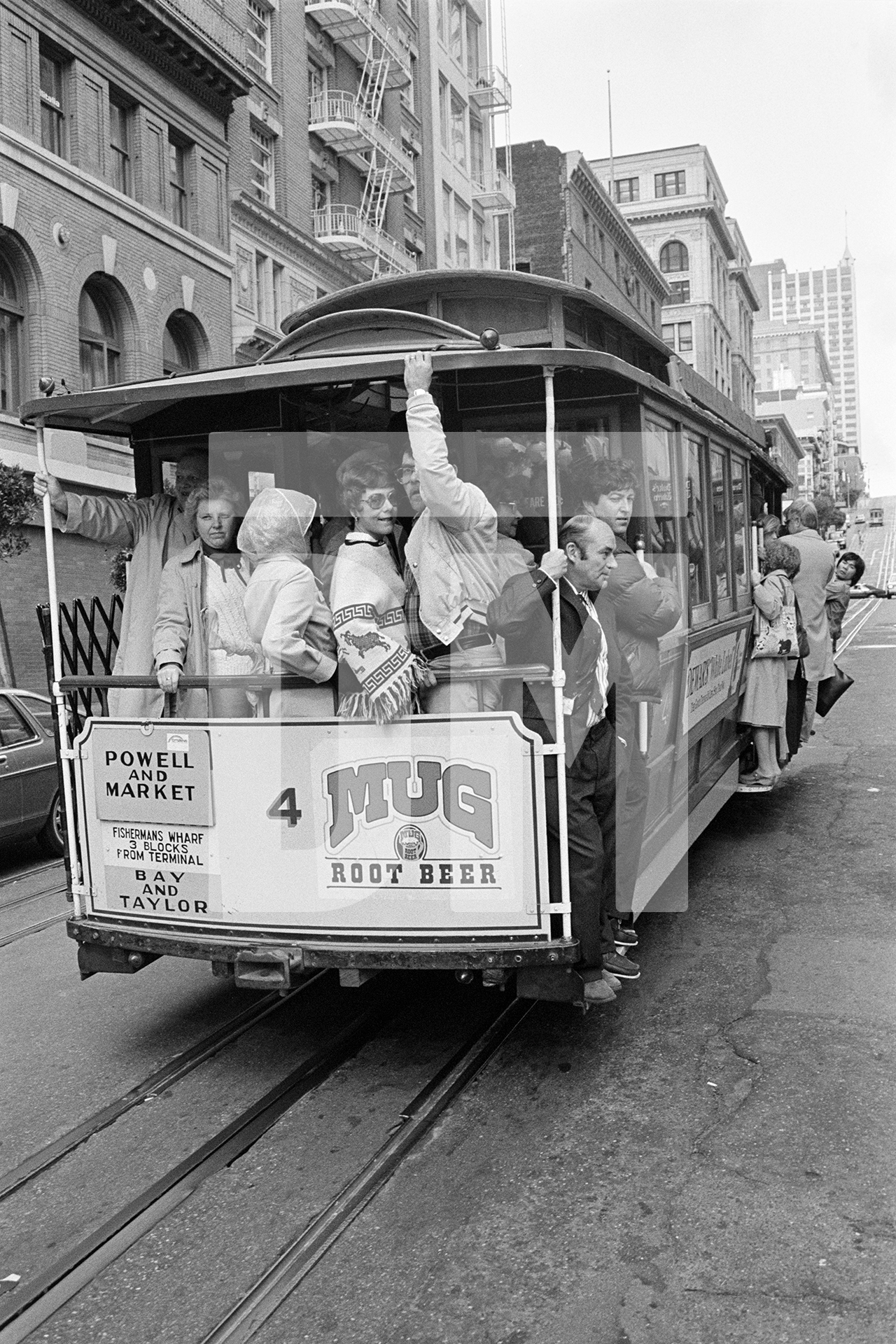 Julian Bream aboard a cable car, San Francisco. November 1981 by Daniel Meadows