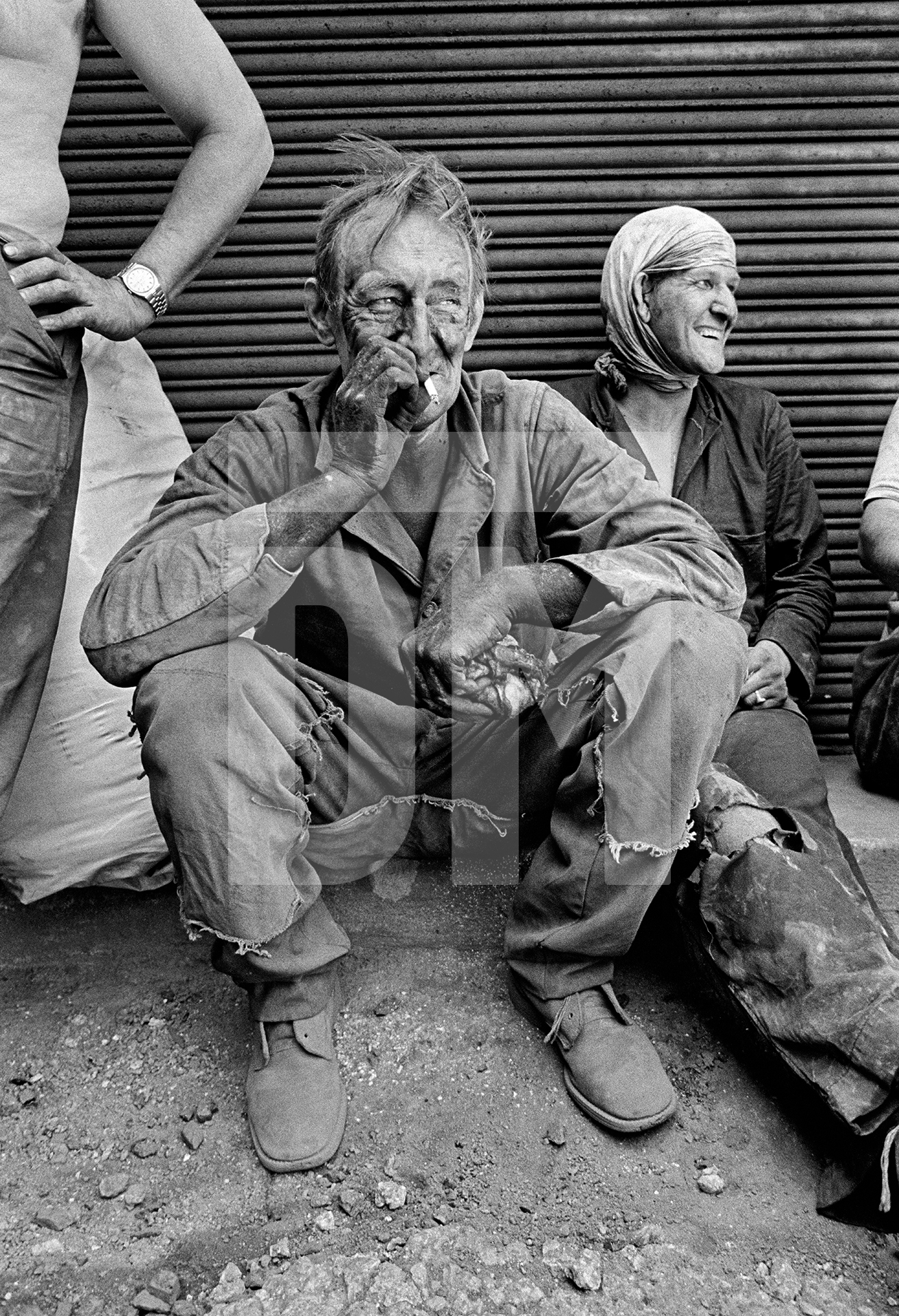 Charlie Sutton, boss of the Weldone gang from Brierfield taking a break duing fluing. Wakes holiday, July 1976 by Daniel Meadows