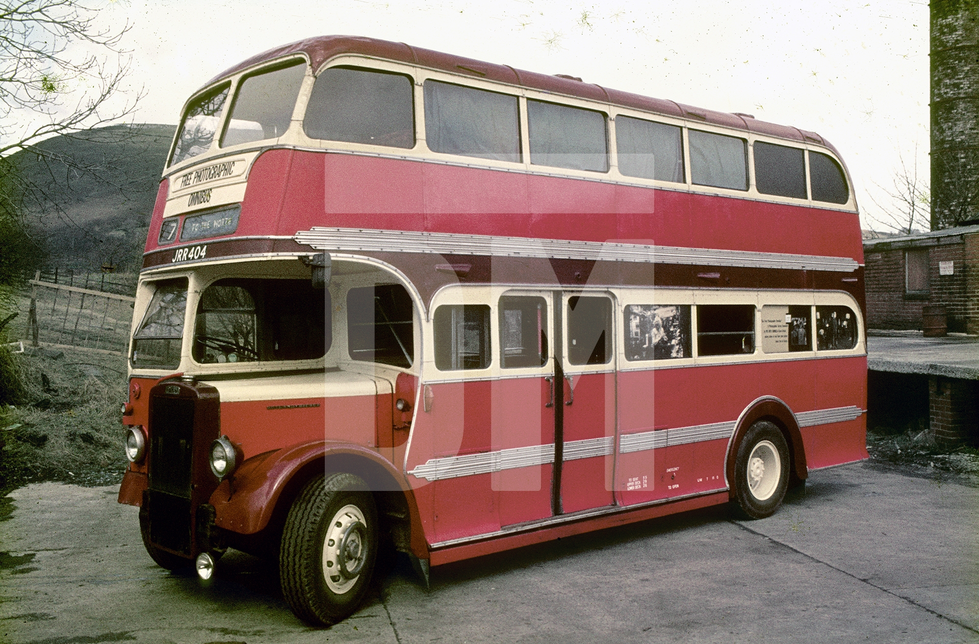 Nearside view of JRR 404, 1948 Leyland Titan PD1 with coachwork by Duple. Commissioned and run by Barton Transport of Chilwell, Nottingham and taken out of service in 1973. Pictured here in 1974 having completed 10,000 miles after being repurposed by Daniel Meadows as his travelling home, gallery and darkroom. by Daniel Meadows
