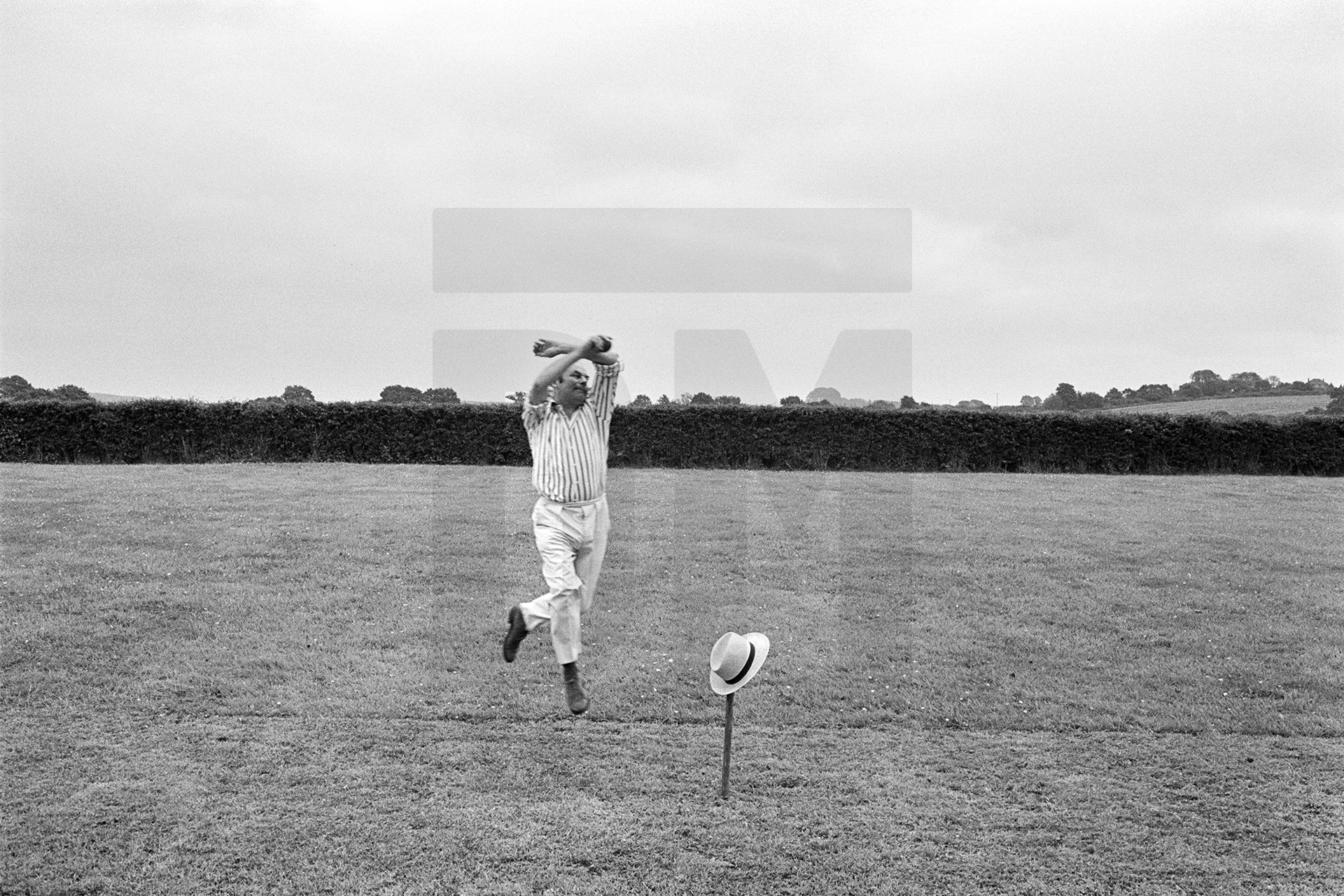 Julian Bream playing cricket by Daniel Meadows