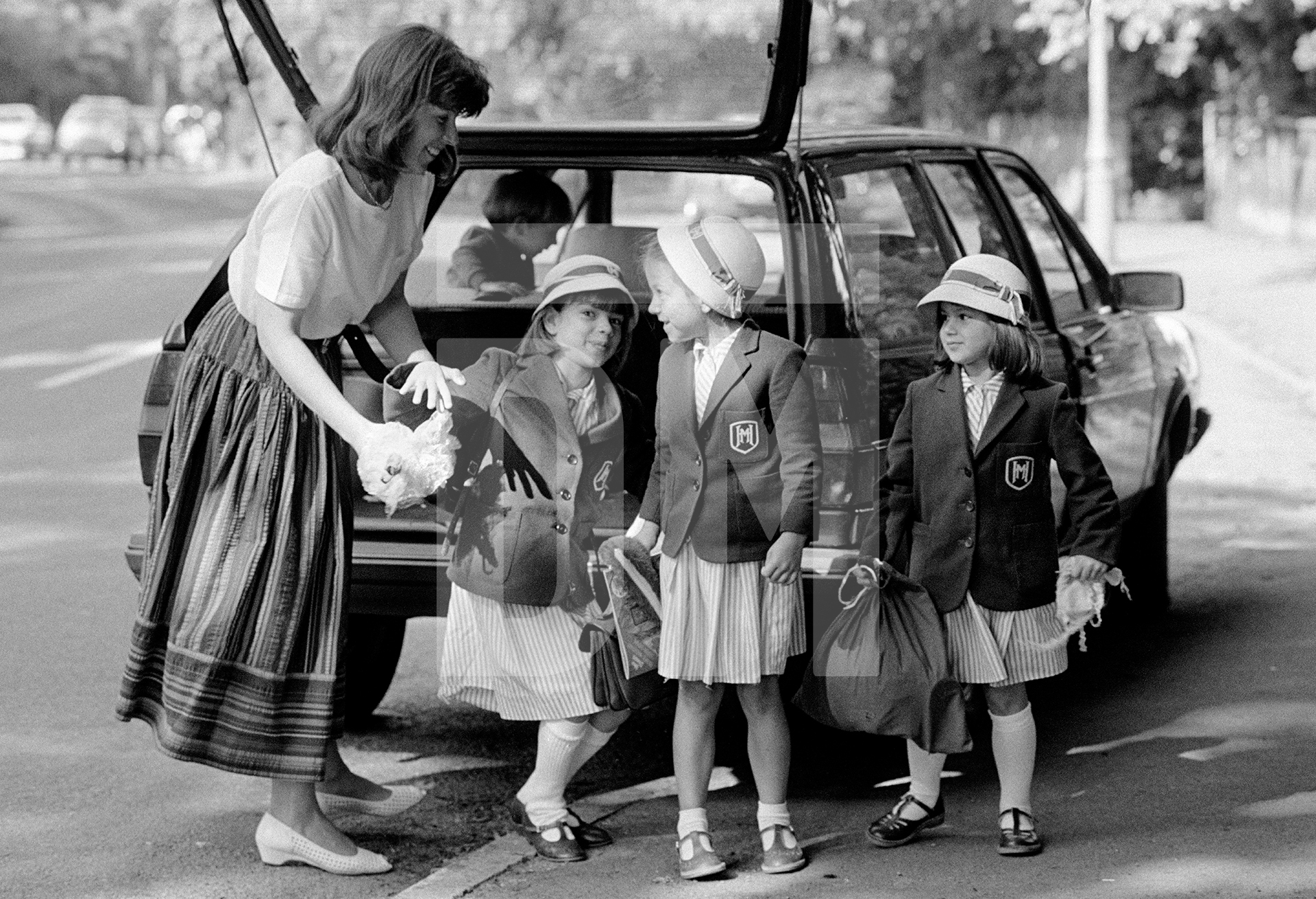 The school run, Beaconsfield, Berkshire. June 1985 by Daniel Meadows