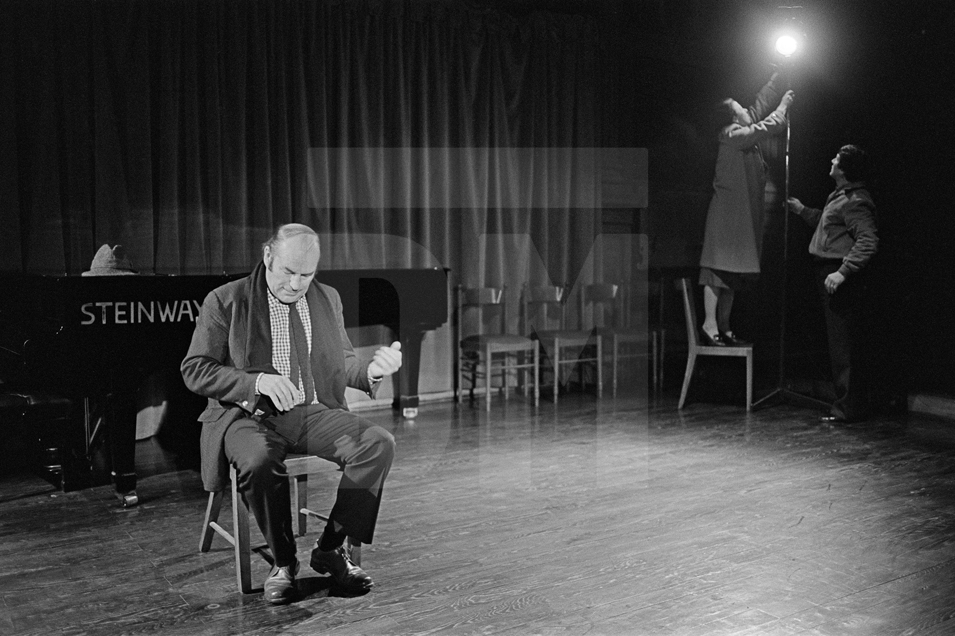 Julian Bream getting the lighting right on a stage where he will shortly perform, Padua, Italy. 12 March 1981 by Daniel Meadows
