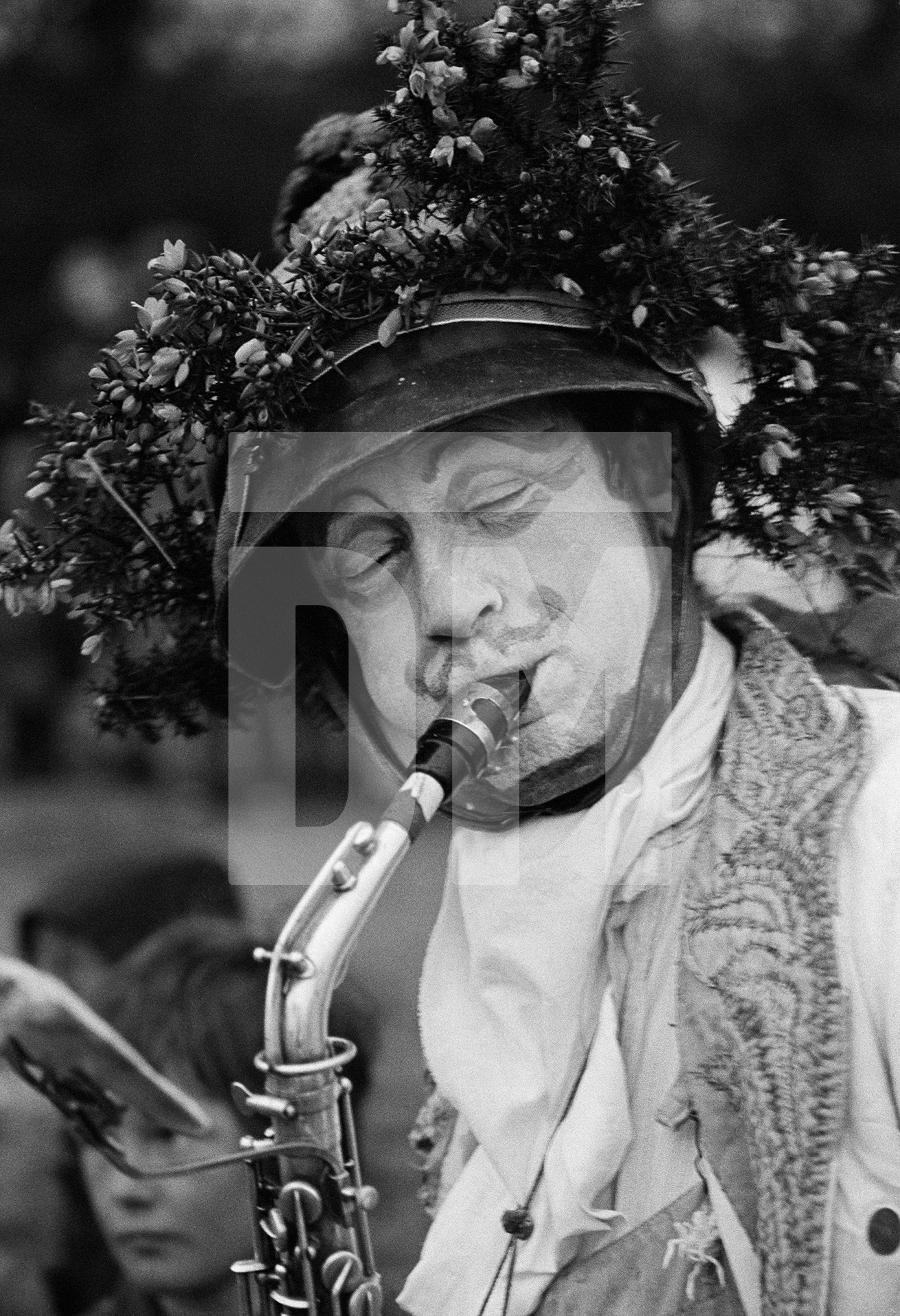 Performer John Fox playing saxophone. Mayday celebration, Burnley and Barrowford along the Leeds-Liverpool canal. 1 May 1976 by Daniel Meadows