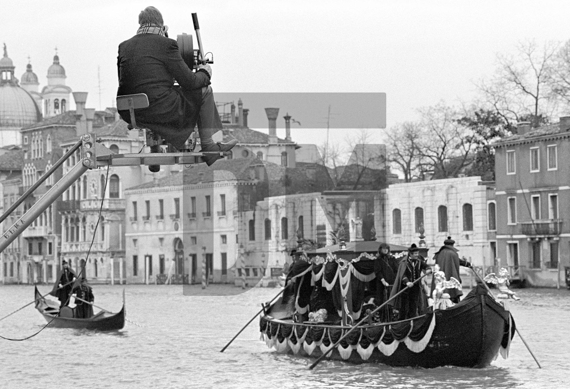 Tony Palmer [director] on a camera crane for his film 'Wagner'. Venice 1982 by Daniel Meadows