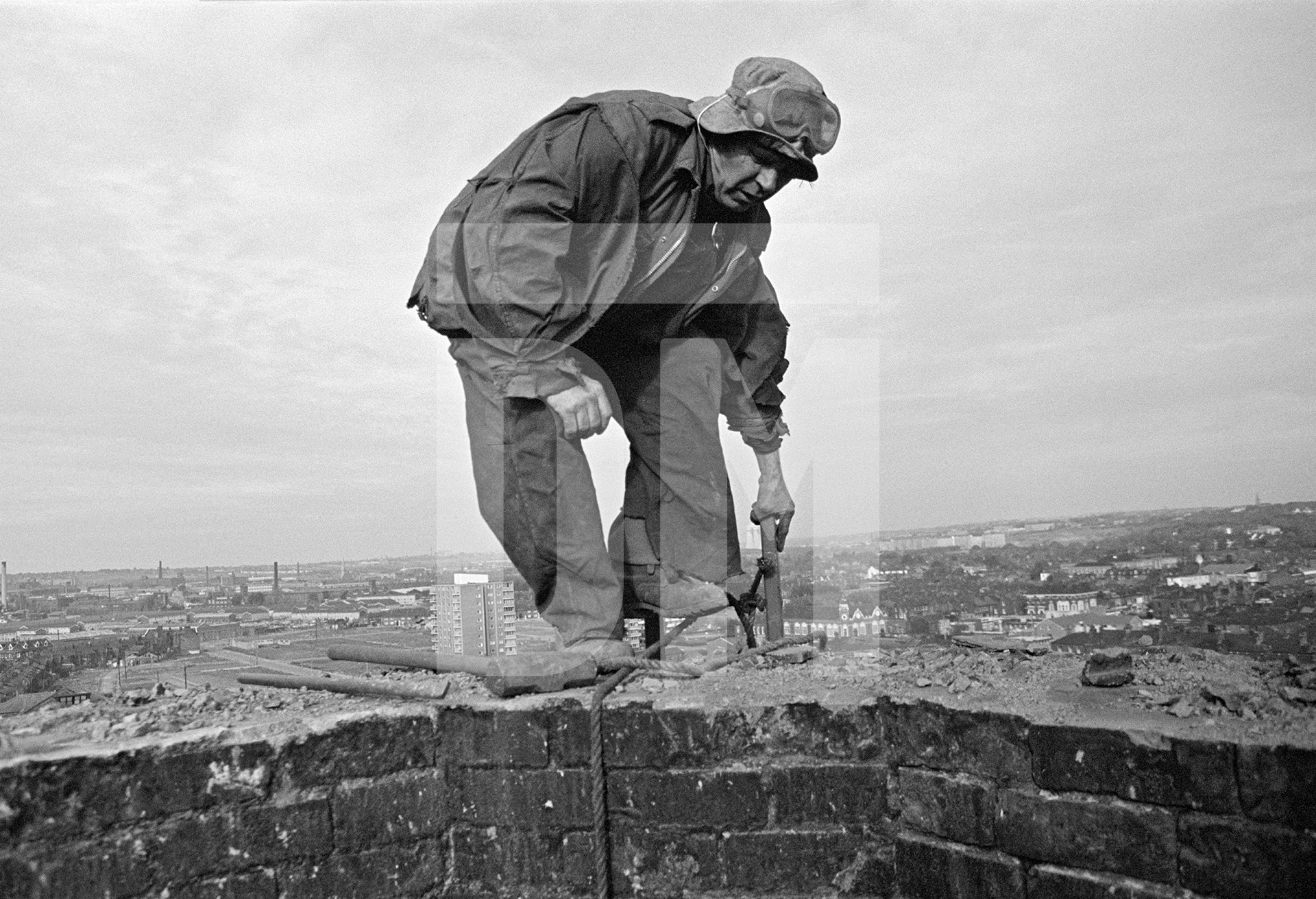 Atop the stack during demolition. September 1976 by Daniel Meadows