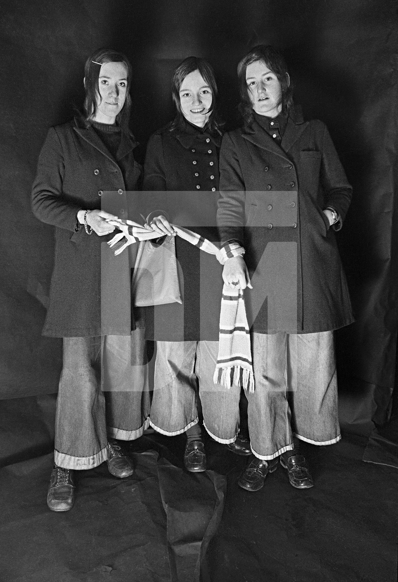 Football fans on their way to see Manchester City play at Maine Road. Group portrait from The Shop on Greame Street, Moss Side, Manchester. February-April 1972 by Daniel Meadows