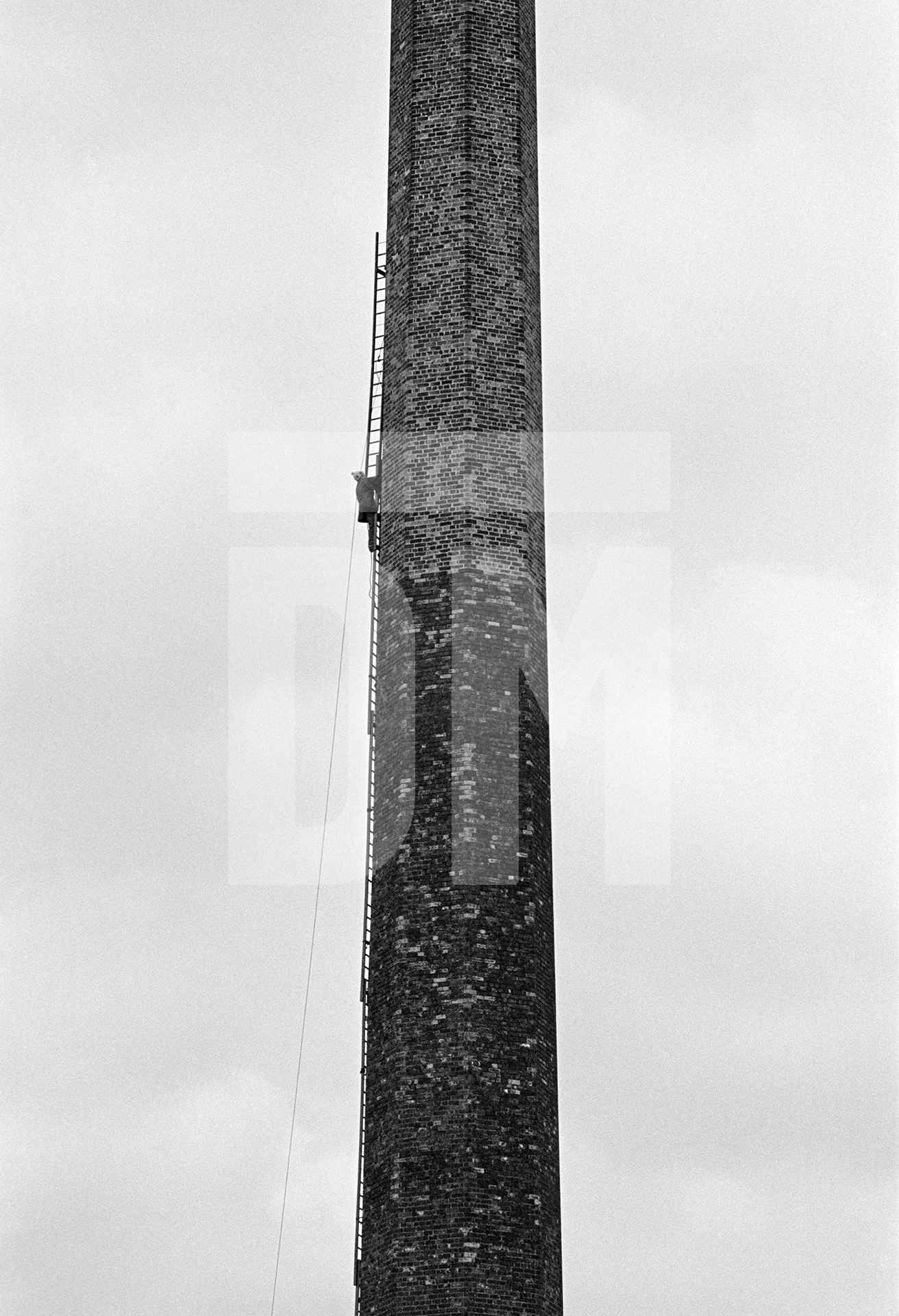 Laddering prior to demolition. Half way up. September 1976 by Daniel Meadows
