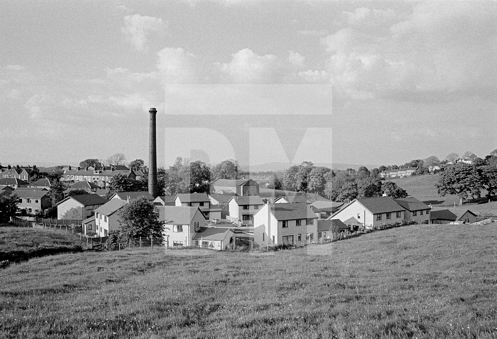 Site of the former mill viewed from the southwest. The mill engine — along with the chimney and boiler house — was saved from demolition and taken over by the Bancroft Mill Engine Trust, a charitable organisation run by volunteers. 1988 by Daniel Meadows