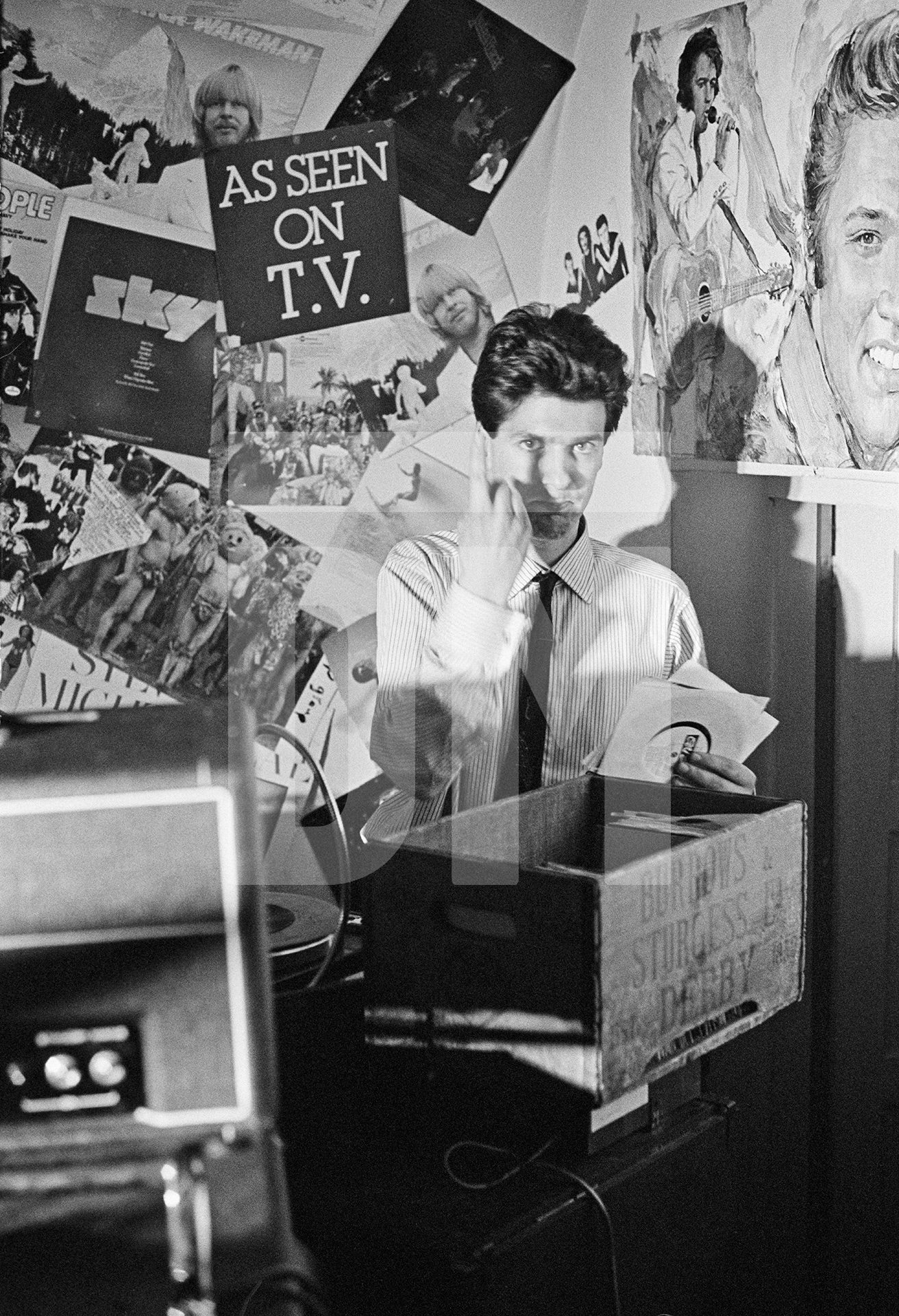 Jon Sage (aka ‘Jon Savage’) DJ-ing at New Osbourne Club, ‘Factory’ gig, Miles Platting, Manchester. 7 February 1980 by Daniel Meadows