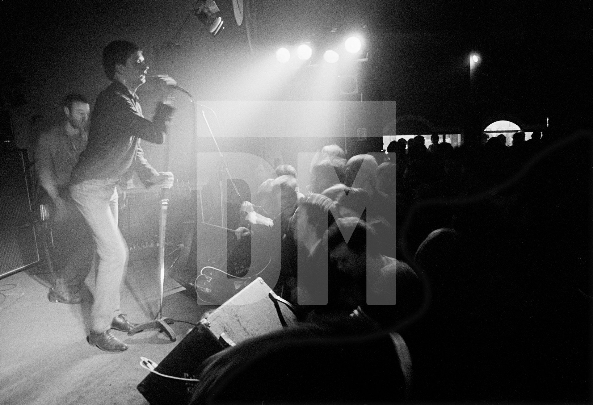 Joy Division on stage at New Osbourne Club, Miles Platting, Manchester. 7 February 1980 by Daniel Meadows