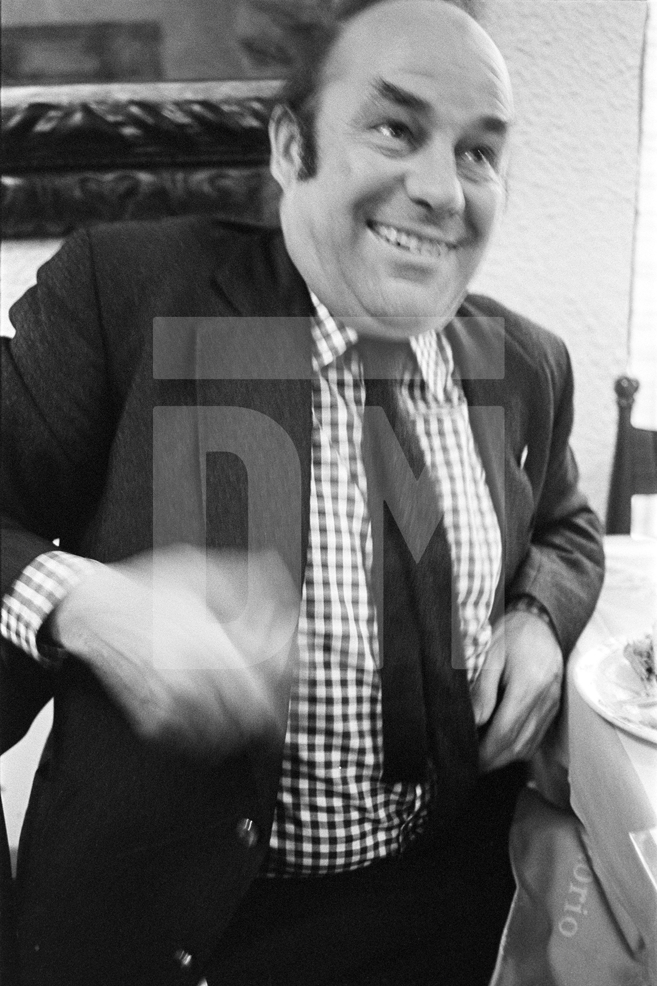 Julian Bream, guitarist, in a restaurant while on tour, Padua, Italy. March 1981 by Daniel Meadows
