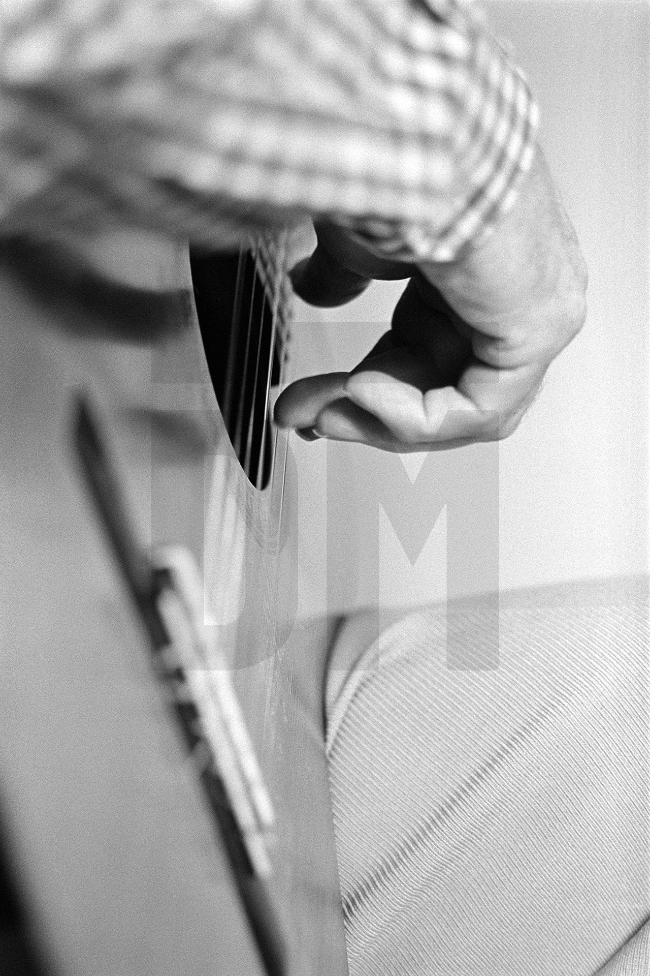 Julian Bream's fingers on the guitar. Semley, Dorset. August 1981 by Daniel Meadows