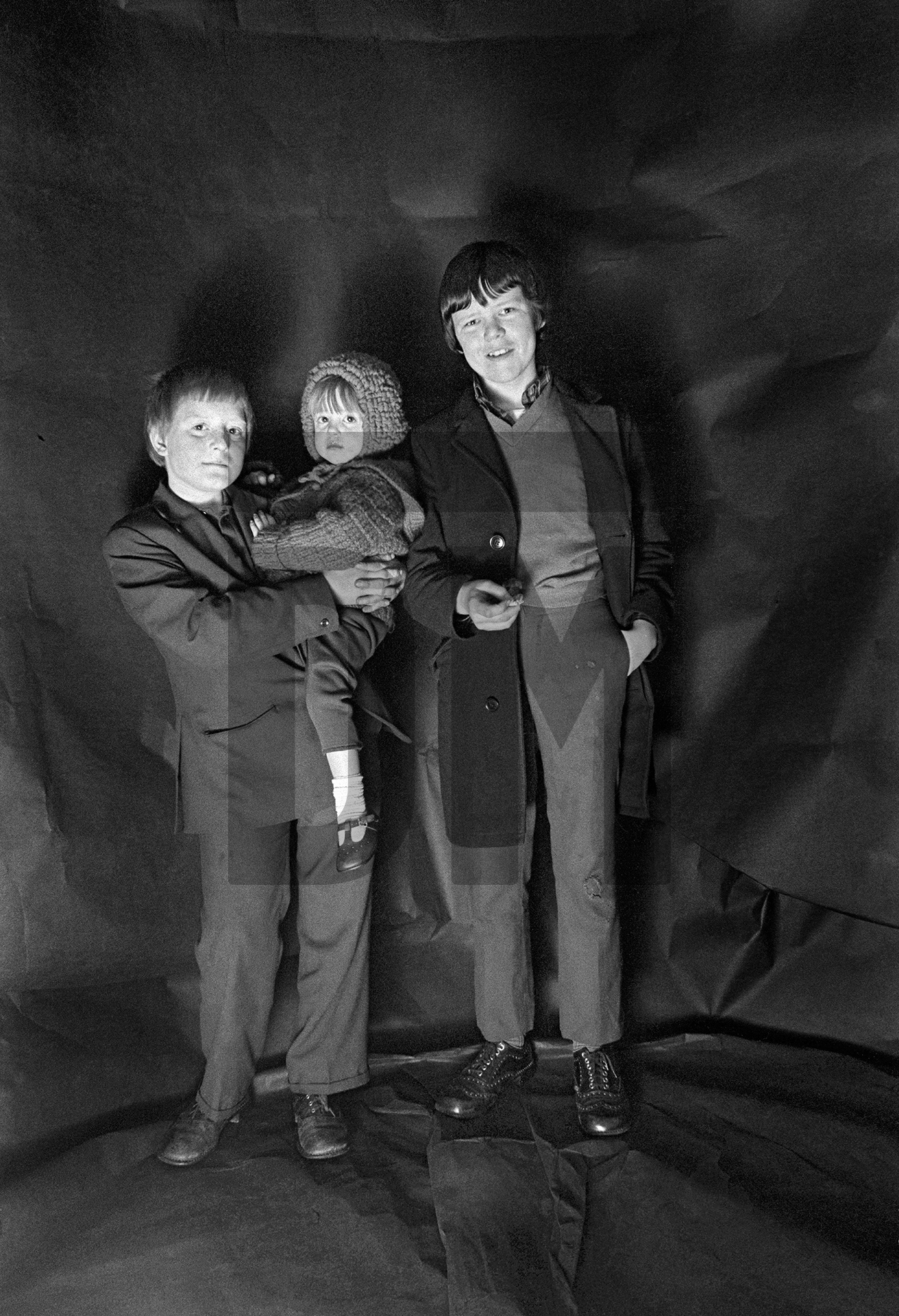 Peter with his sister Gillian and friend Peter Jackson. Group portrait from The Shop on Greame Street, Moss Side, Manchester. February-April 1972 by Daniel Meadows