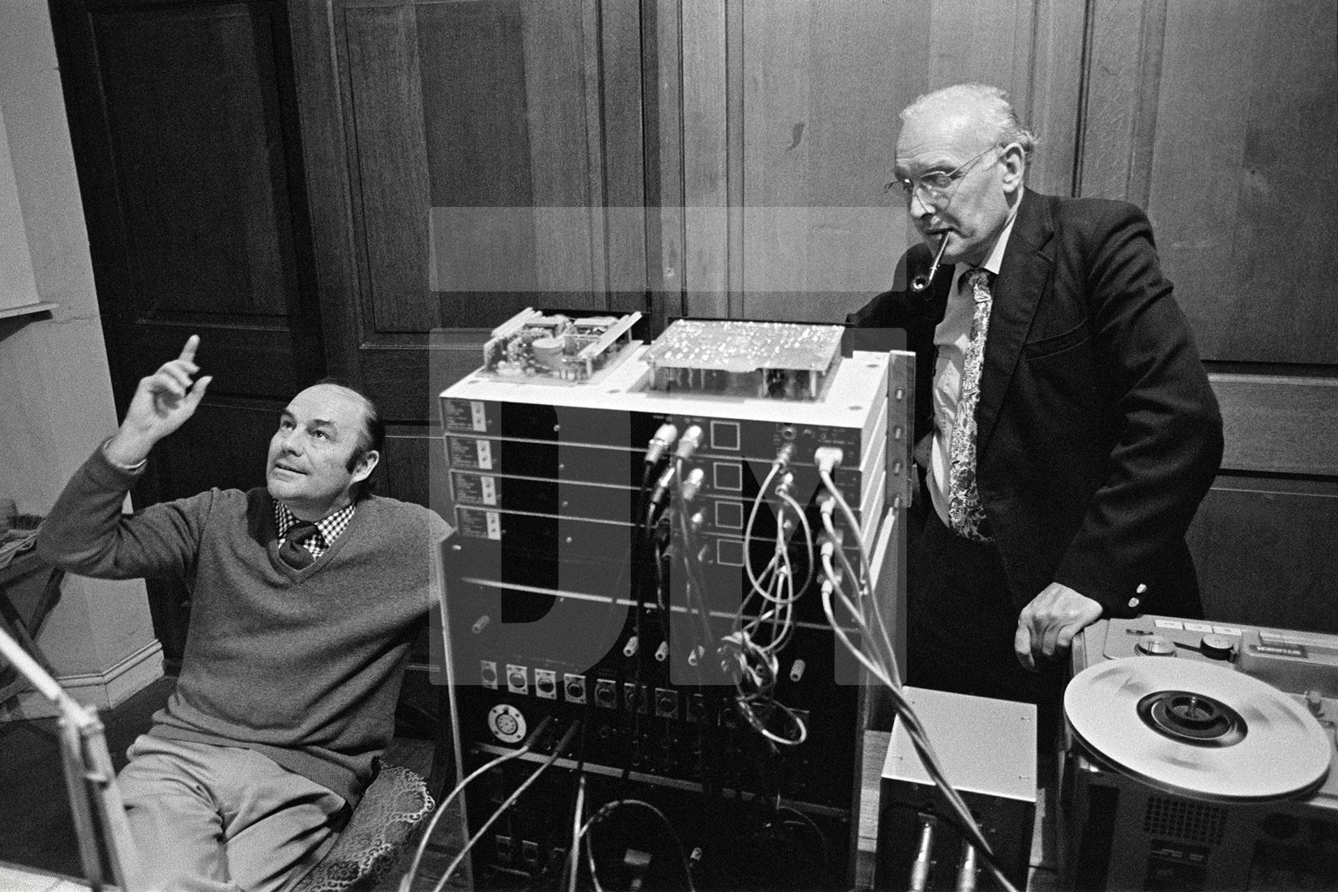 Julian Bream, with engineer John Bower, during recording session, Wardour Chapel, Tisbury, Wiltshire. October 1981 by Daniel Meadows