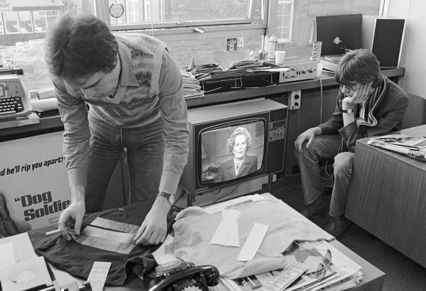 In the ‘What’s On’ office, producer Geoff Moore (left), with director David Liddiment watch Margaret Thatcher on the screen, Granada TV, Quay Street, Manchester. April 1979