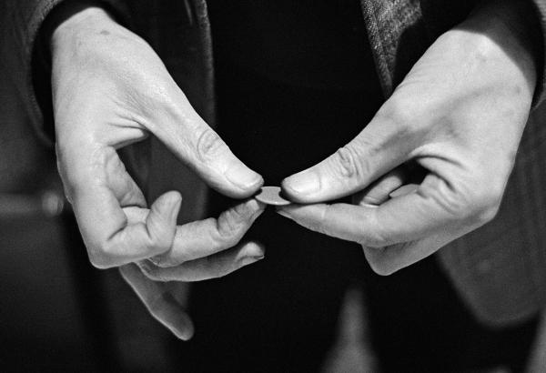 A patient holds a token. Tokens are needed to buy not just tobacco and sweets but also food and drink. Patients earn tokens by displaying ‘good’ behaviour: engaging in ‘verbal interraction’, making the bed, wearing a tie, tucking-in shirt-tails and so on. February 1978